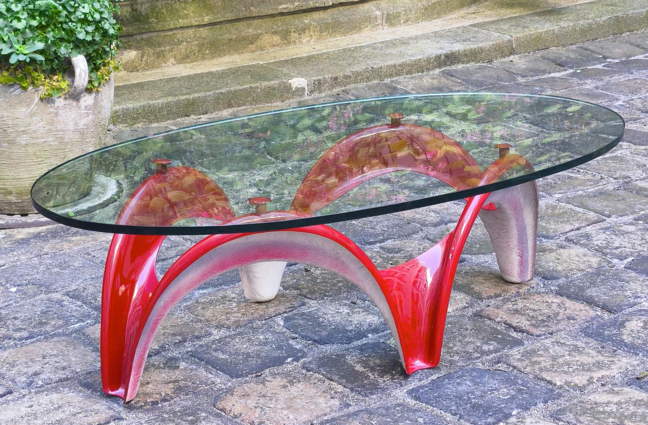 Aage Egeriis fiberglass coffee table base, 1960s, France et Fils, Poul Cadovius as editor.
.
Laquered in red.
.
Dimensions : 
Height : 43 cm
Width : 60 cm
Length : 120 cm
Approximative weight : 6 kgs
.
The oval glass top has been positioned on the