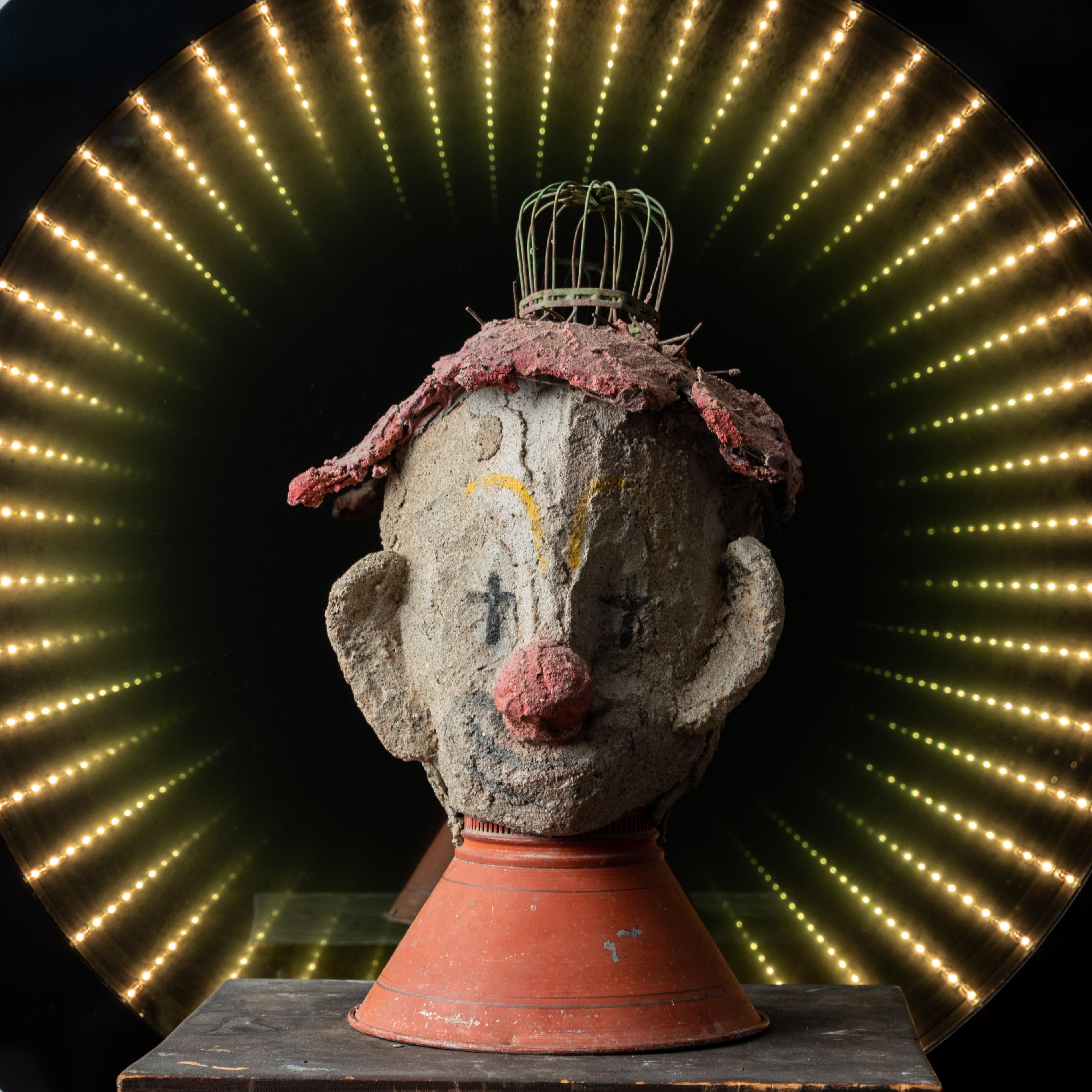 Aage Hogfeldt

(American, 1925-2014)

A clown bust made from concrete and found lamp parts. 

10 by 10 by 17 inches

In 1954 Aage Hogfeldt founded an artist colony in an old icehouse on Route 1 in Westbrook on the shore east of New Haven,