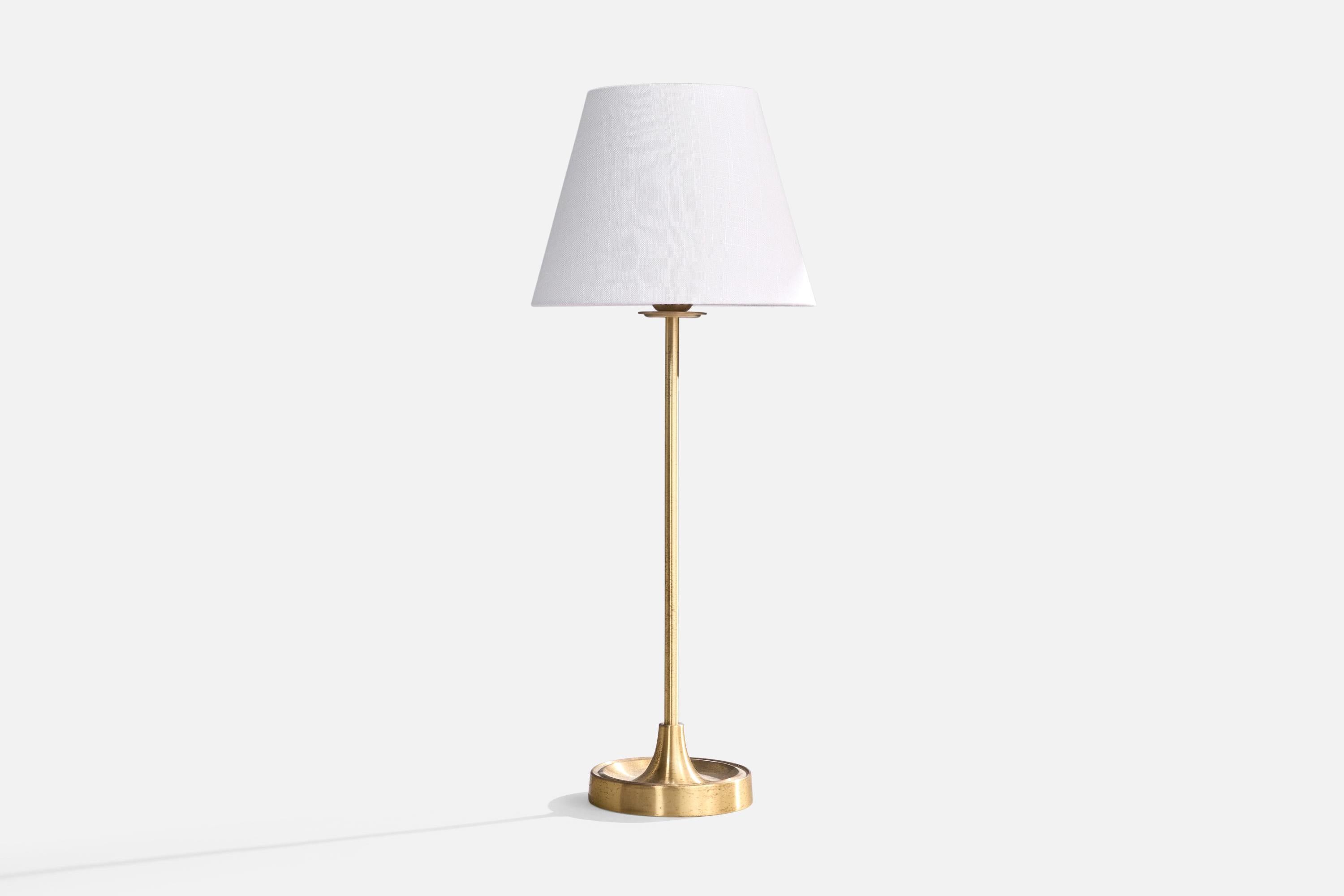 A sizable table lamp designed by Aage Petersen and produced by Le Klint. Denmark, c. 1970s.

Light to moderate oxidation present throughout lamp.

Dimensions of Lamp (inches): 19.75” H x 5.75” Diameter

Dimensions of Shade (inches): 6” Top Diameter