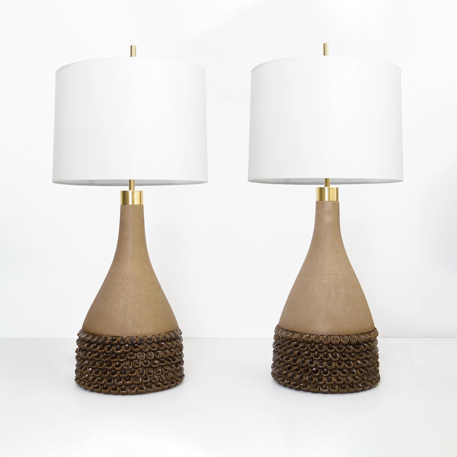 Very large pair of ceramic lamps created by Aage Rasmus Selsbo at his studio Selsbo Keramik, Sweden late 1960’s. The lamps have new customs hardware in brass including a double cluster with standard base sockets for use in the USA. Signed on bottom