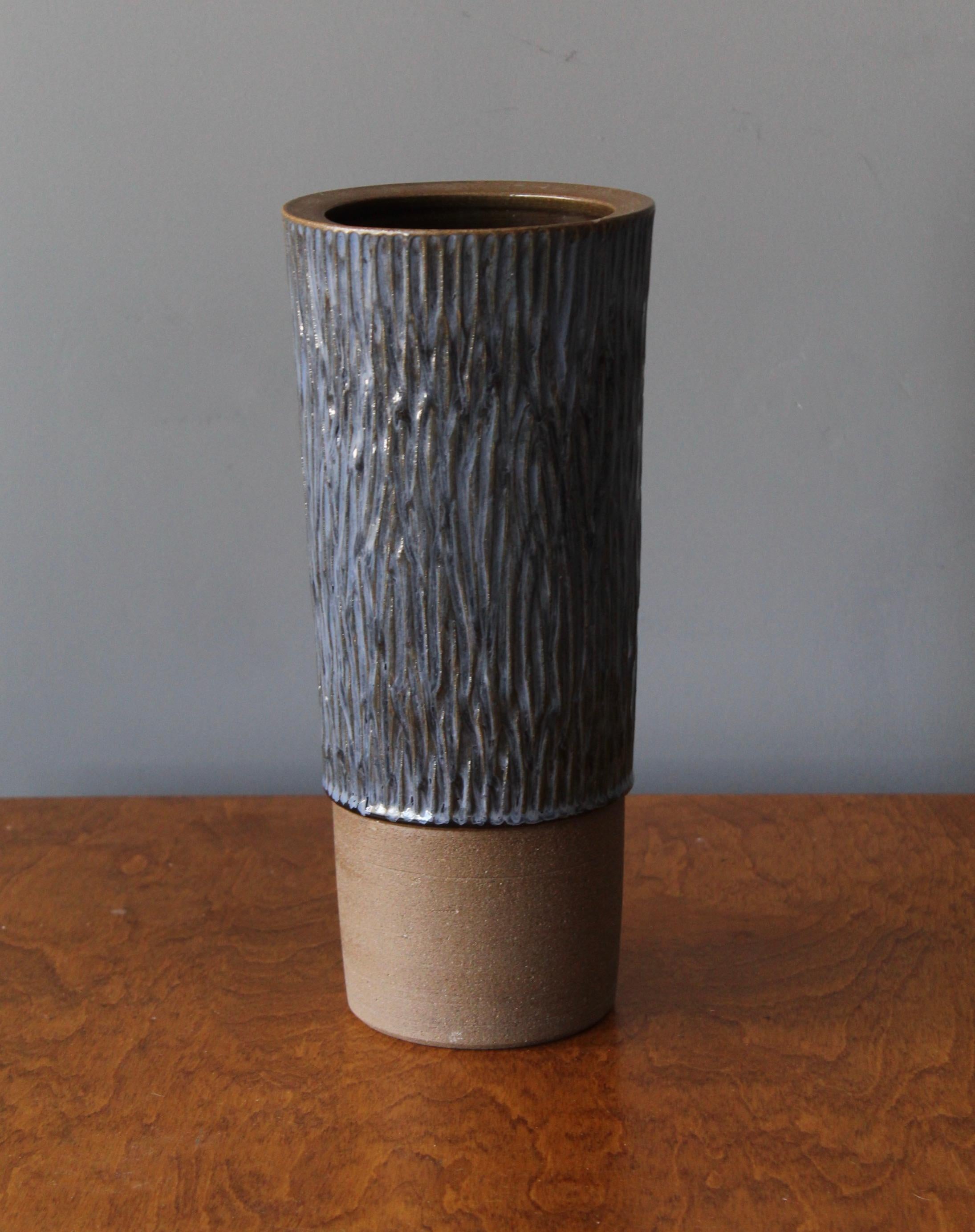 A sizable vase produced by Danish ceramicist Aage Rasmus Selsbo in his studio, Simlångsdalen, Sweden, 1960s. Features Blue glaze and subtle incised decoration. Labeled.

