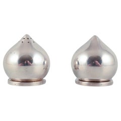 Used Aage Weimar, Danish silversmith.  Pair of modernist salt and pepper shakers.