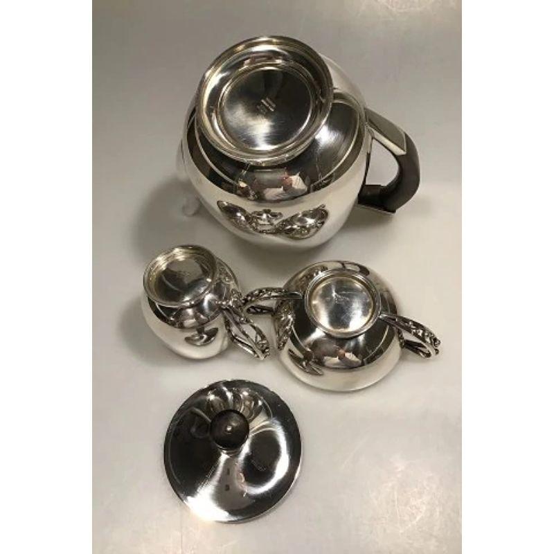 Aage Weimar, Sterling Silver, Coffee set (3)

Coffee Pot Measures 18 cm(7 3/32 in) Weight 654 gr/19.90 oz
Sugarbowl Measures 5 cm(1 31/32 in)Weight 114 gr/4 oz
Creamer Measures 7 cm(2 3/4 in) Weight 110 gr/ 3.90 oz
