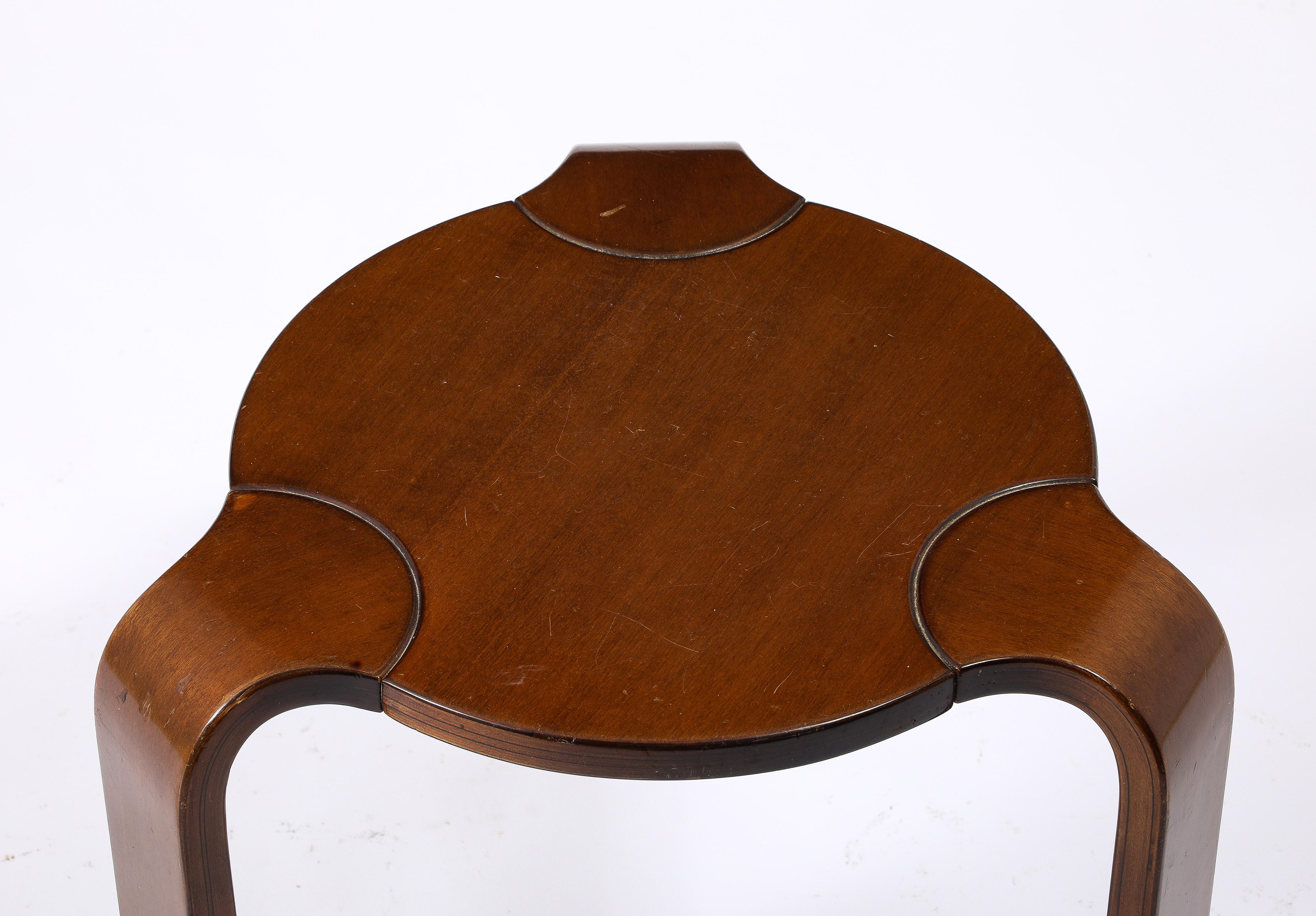 Rich mid-tone brown finish. Expressed joints similar to Alvar Aalto designs. 
