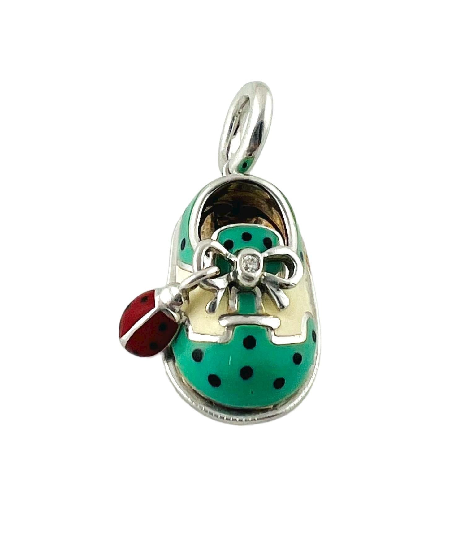 Aaron Basha 18K White Gold Blue Saddle Shoe with Ladybug Accent

This authentic Aaron Basha baby charm is set in 18K white gold with blue and white enamel

White gold shoe lace is centered with a round brilliant diamond approx. .01cts and VS1, G