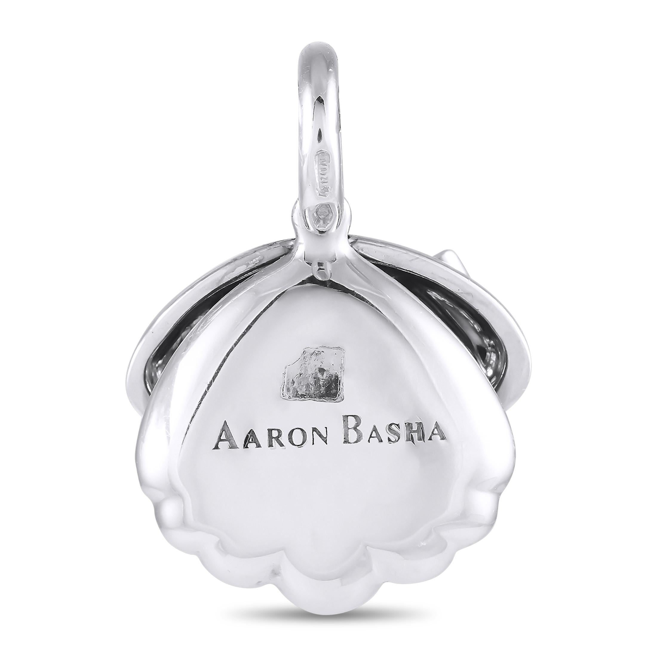 Come out of your shell and let your true colors shine with this quirky piece of fine jewelry. From Aaron Basha, here is a playful bracelet charm that also works as a pendant. It features a clamshell silhouette in 18K white gold, finished in orange
