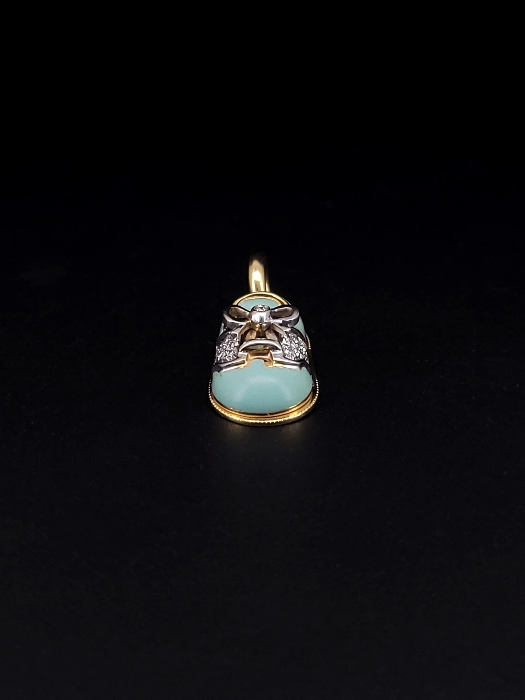 Bright and beautiful like a blue sky on a sunny day, this Aaron Basha 18kt yellow gold baby shoe charm is generously coated in light blue enamel and accented with a white enamel saddle. A .01 carat diamond tops off the shoestring to really catch the