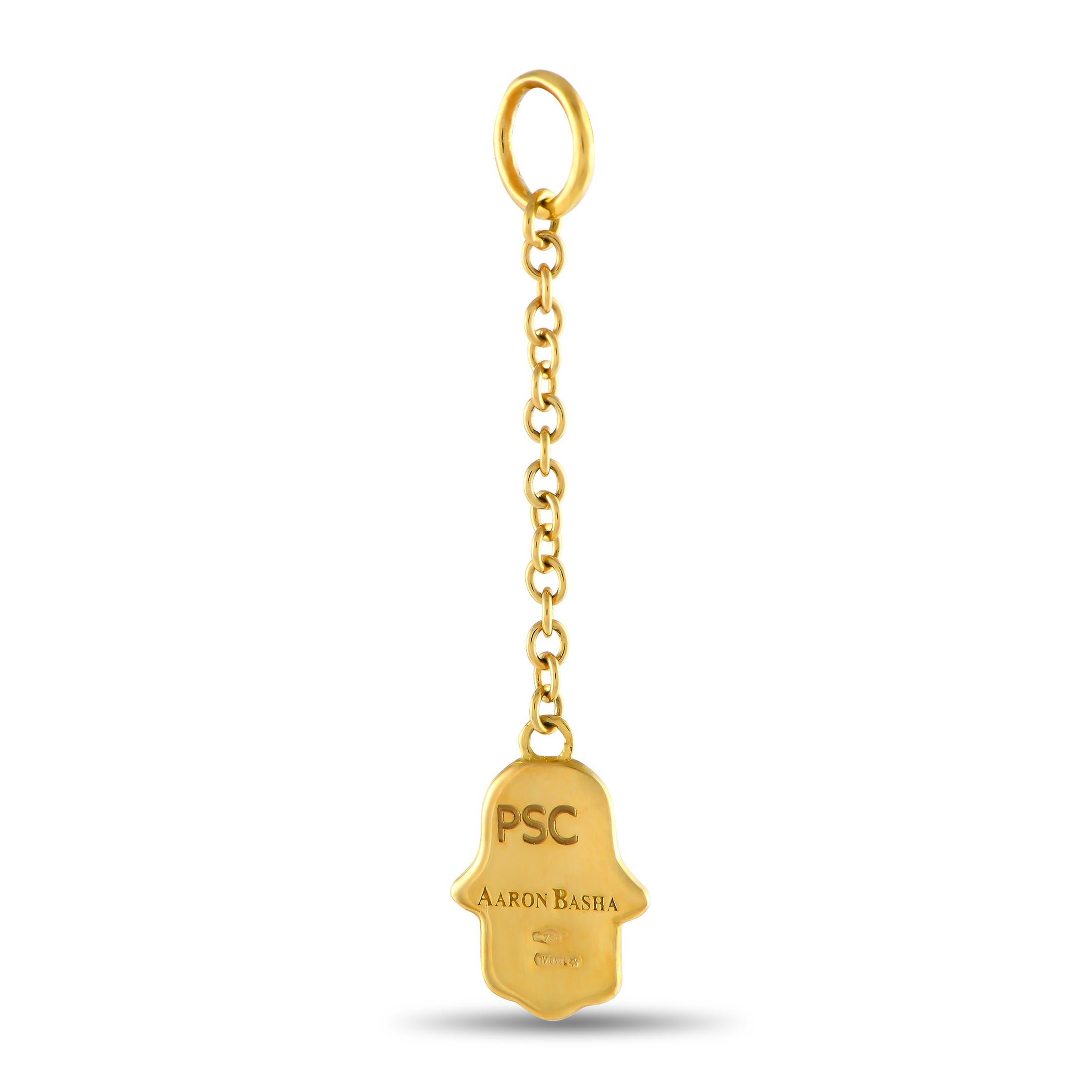 A protector. A lucky charm. A style statement. This Hamsa Hand charm from Aaron Basha will serve you in multiple ways. Use it as a bracelet charm, a bag charm, or a pendant. The piece is expertly crafted in precious yellow gold, and finished in