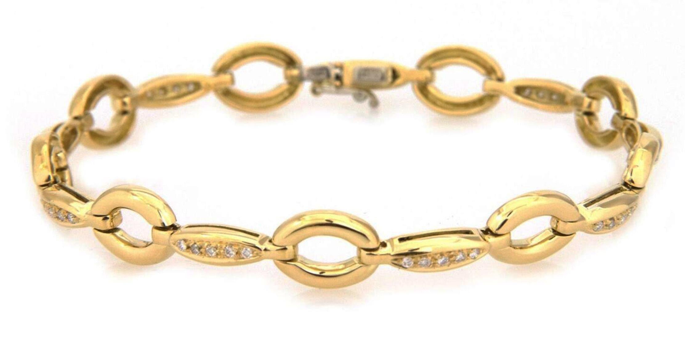 This is an elegant authentic bracelet from Aaron Basha, crafted from 18k yellow gold featuring alternating oval polished links with a long slim marquise bar link, each bar has a row of single cut diamonds, all totaling 21 points. The bracelet secure