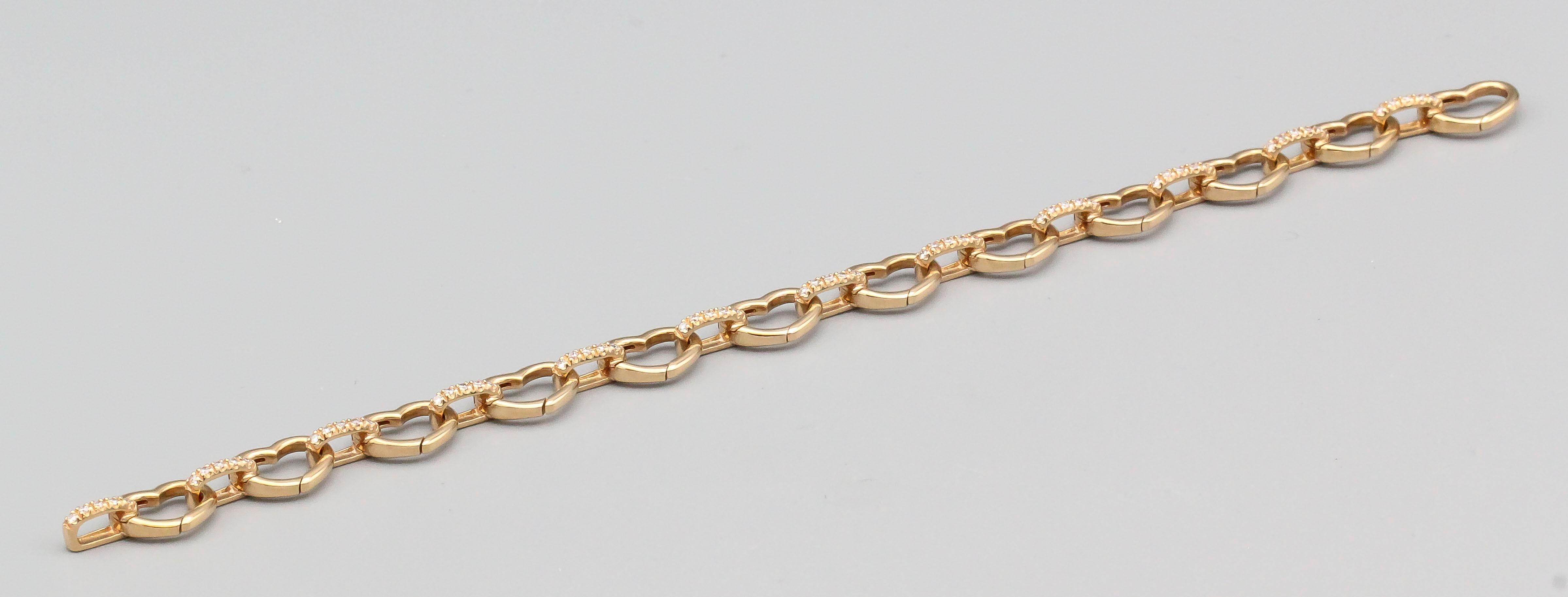 Fine diamond and 18K rose gold heart bracelet for charm by Aaron Basha.  Charms can be added by pushing in the spring lever on the hearts, allowing addition and removal of charms easily.  This is the smaller of the two sizes and current retail price