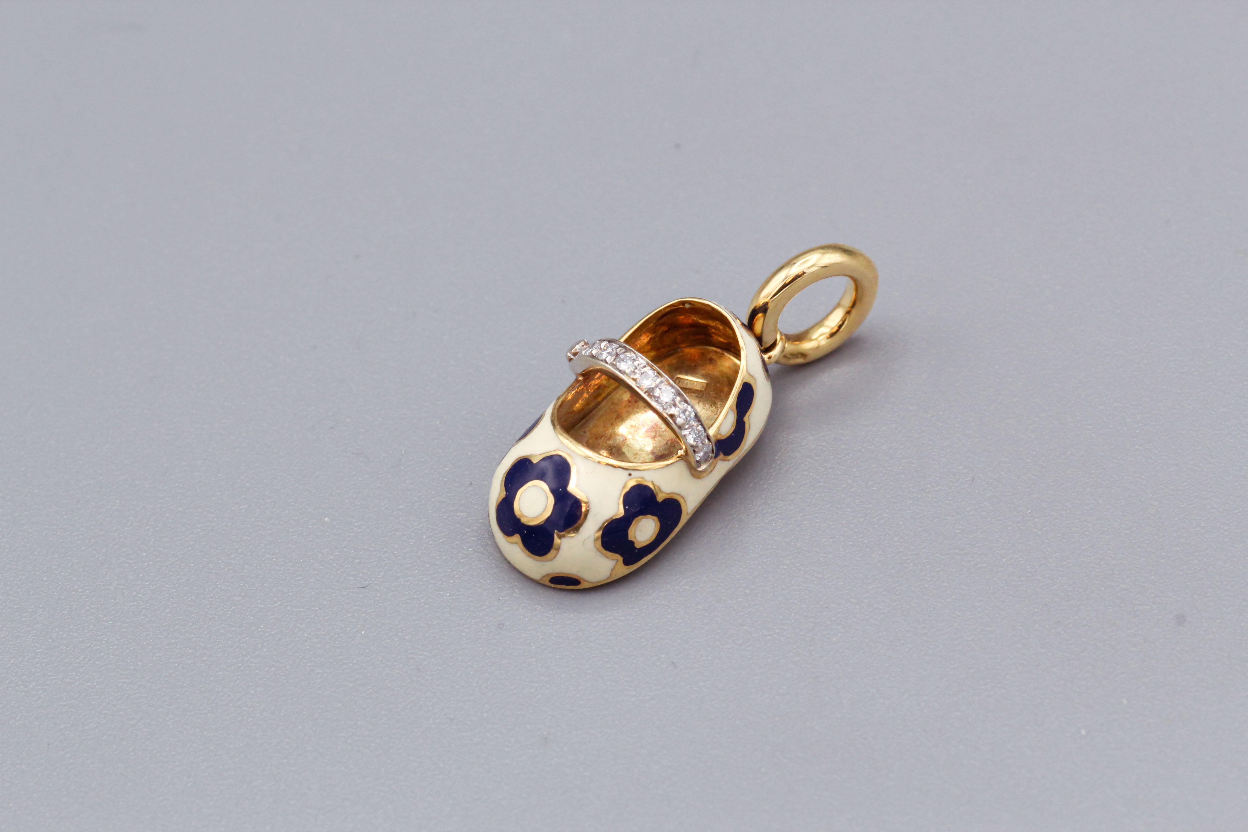 This fine Aaron Basha baby shoe charm in 18k gold with enamel is a beautiful and intricate piece of jewelry that is designed to celebrate the birth of a child. This charm is small and delicate, measuring approx. 3/4