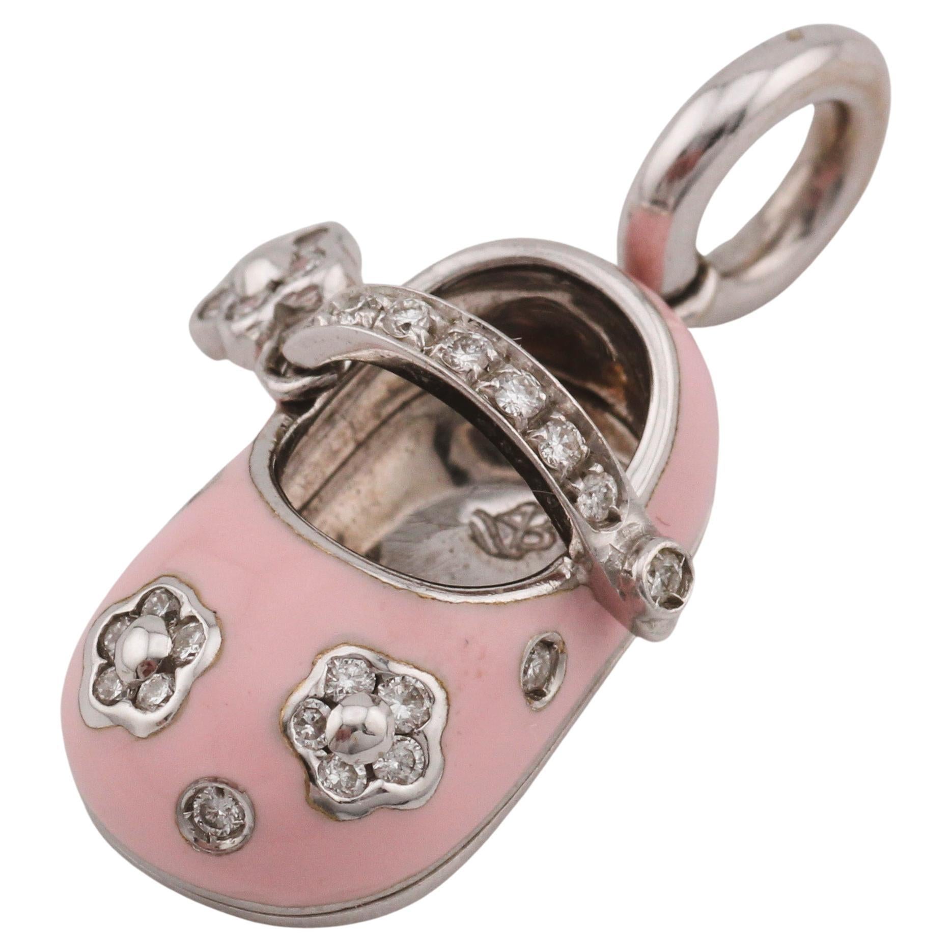 Introducing the captivating Aaron Basha Diamond Pink Enamel 18K Gold Flower Motif Baby Girl Shoe Charm Pendant, a delightful fusion of whimsy and sophistication. Crafted with meticulous attention to detail, this enchanting pendant captures the