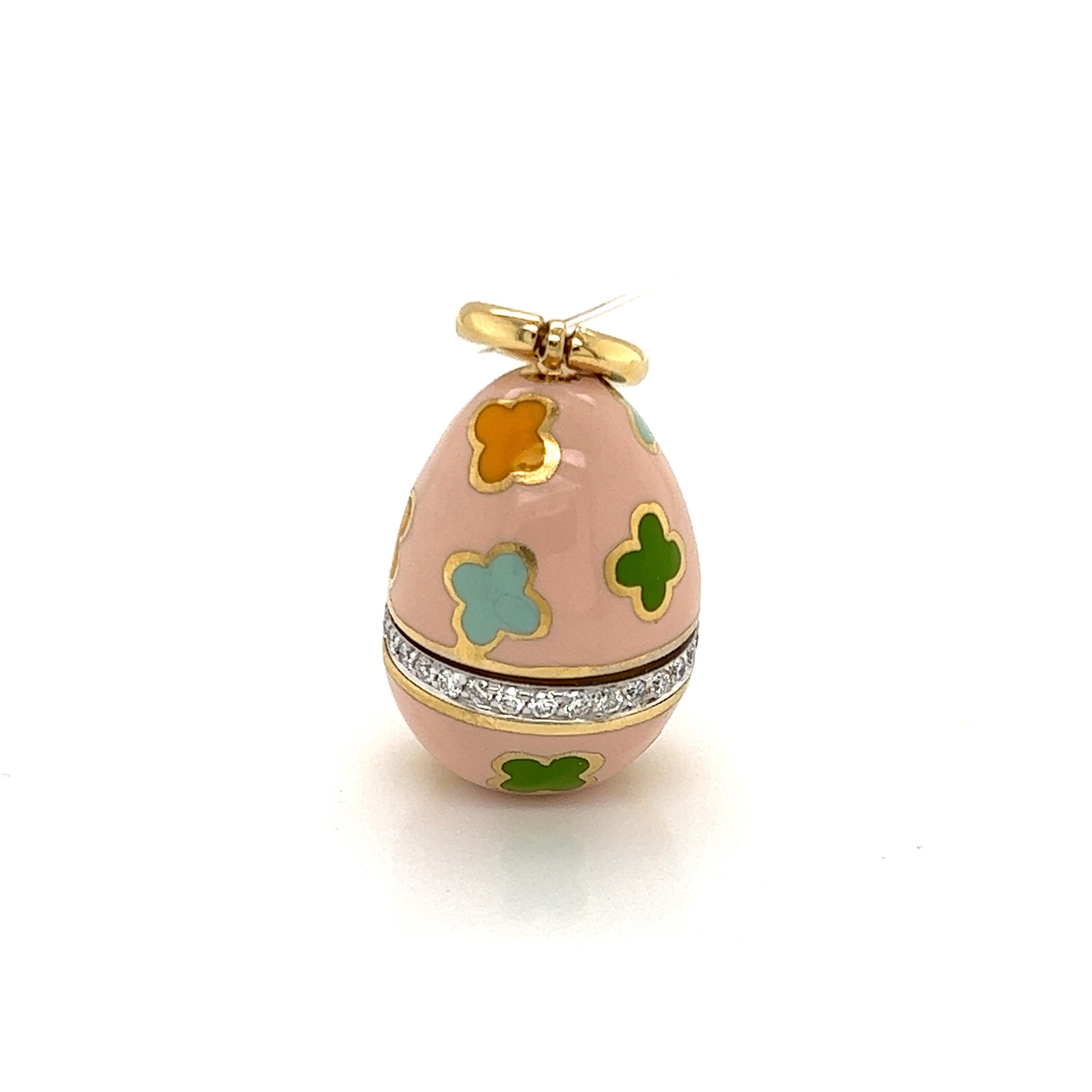 This cute authentic pendant is by Aaron Basha, crafted from 18k yellow gold featuring an egg shape pendant with pink enamel surface and decorated with blue green and yellow enamel flowers. The lower end part of the egg has a circle decorated with