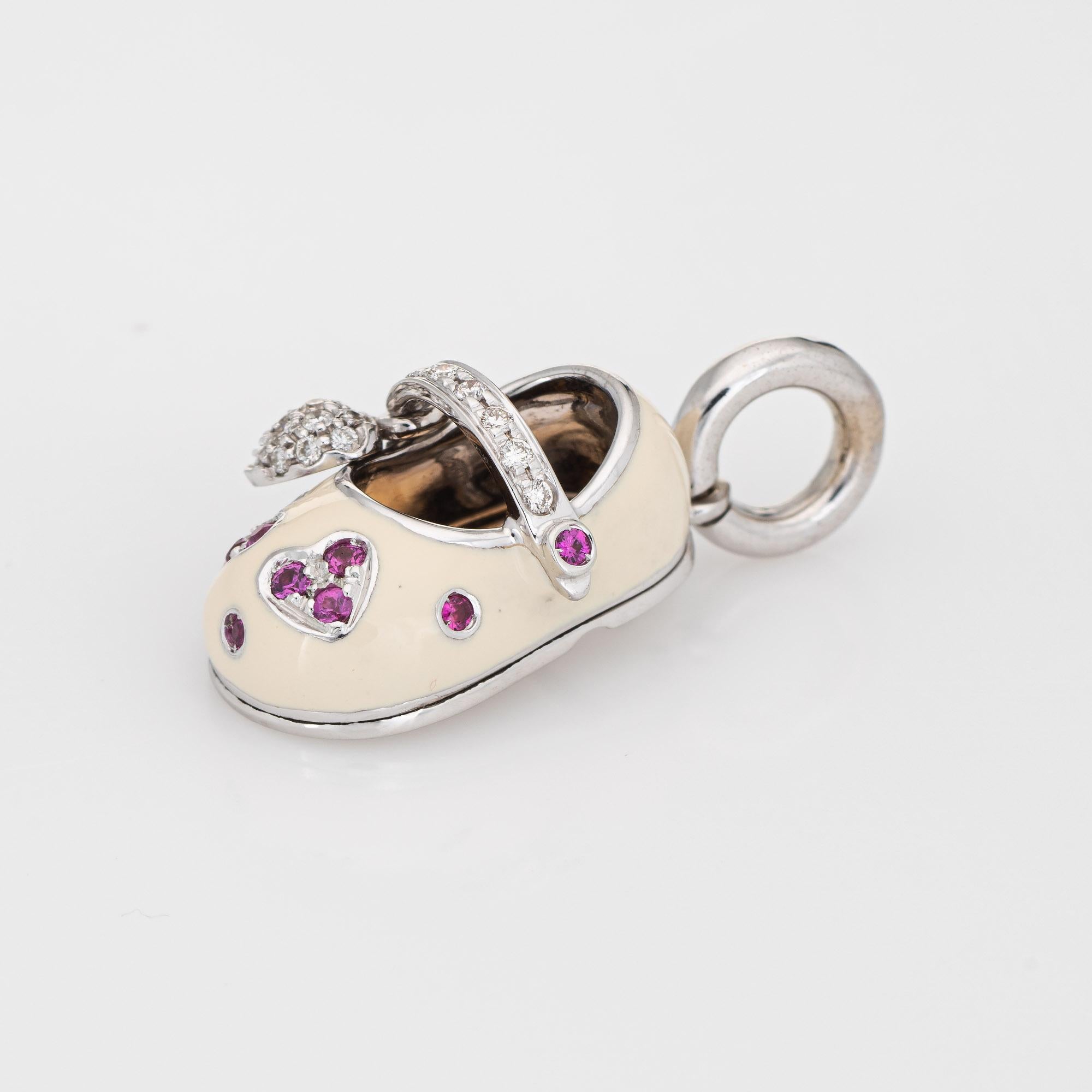 Finely detailed pre owned Aaron Basha gemstone shoe charm crafted in 18k white gold.  

Round brilliant cut diamonds are pave set into the shoe and total an estimated 0.15 carats (estimated at H-I color and VS2-SI1 clarity). 10 rubies total an