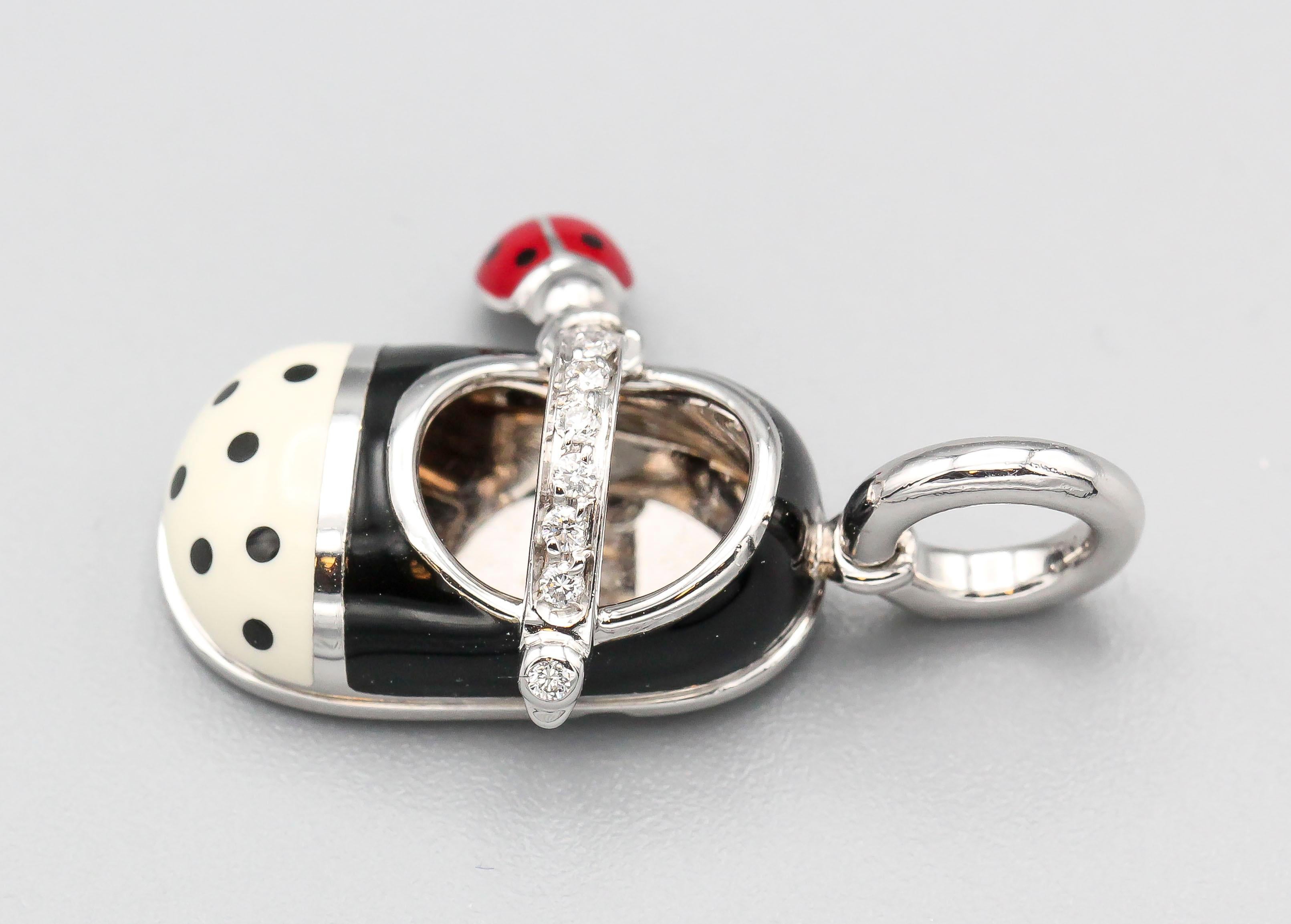 Fine diamond with polka dot enamel and 18K white gold baby girl shoe charm by Aaron Basha. Features high grade round brilliant cut diamonds by the strap of the shoe along with a small attached ladybug charm.

Hallmarks: Aaron Basha,  750, Italian