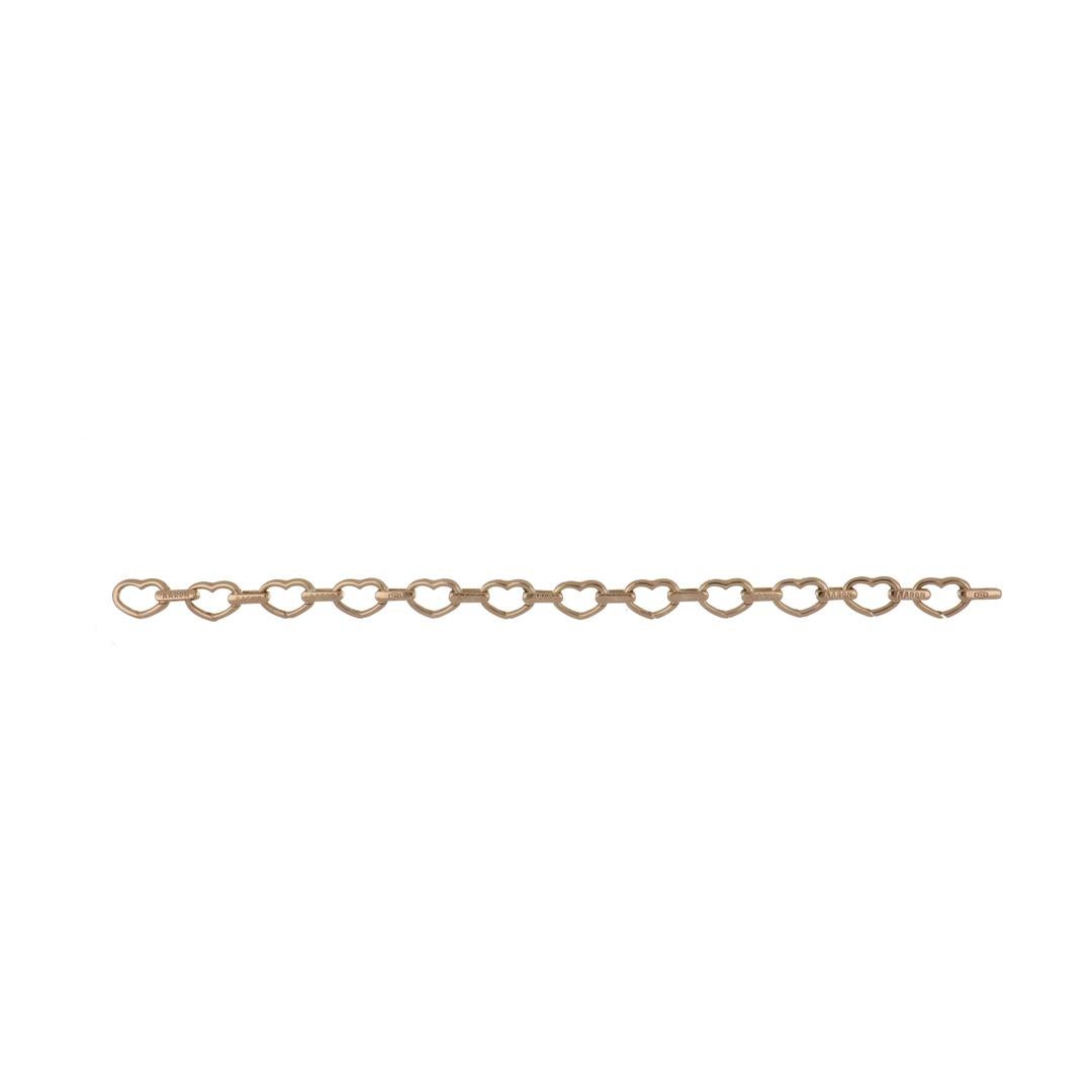 Basha heart shaped full pavé open-link (small) bracelet in 18K rose gold.  Each diamond heart is hinged so it can open to add a charm.  There are 228 round diamonds that total 1.71 carats; F-G color and VS clarity.  It measures 6 1/2 inches long and
