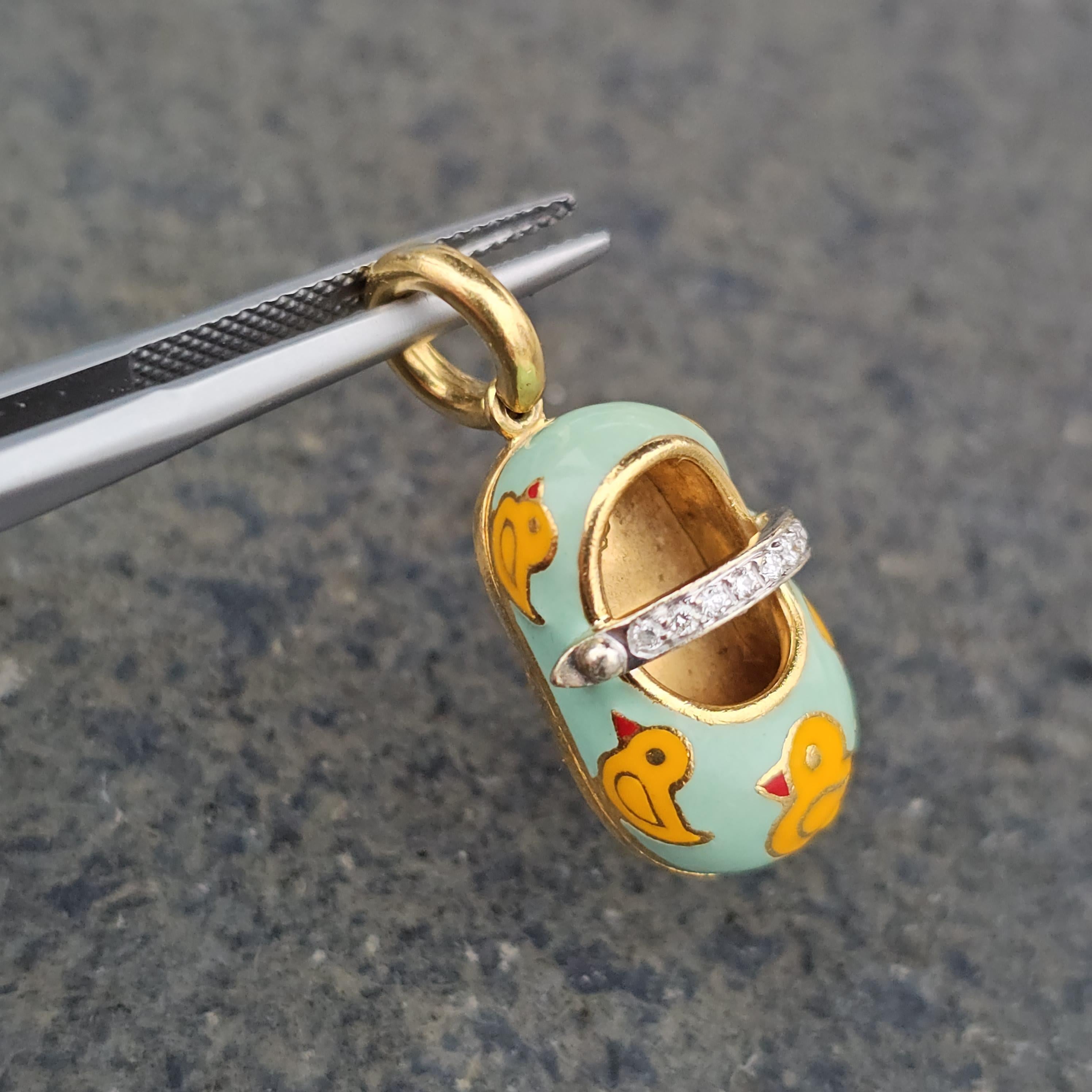 Here we have a charming rubber duckie Aaron Basha baby shoe charm in 18k yellow gold with diamond accents.

**Specifics**
- Measurements: ~1.0