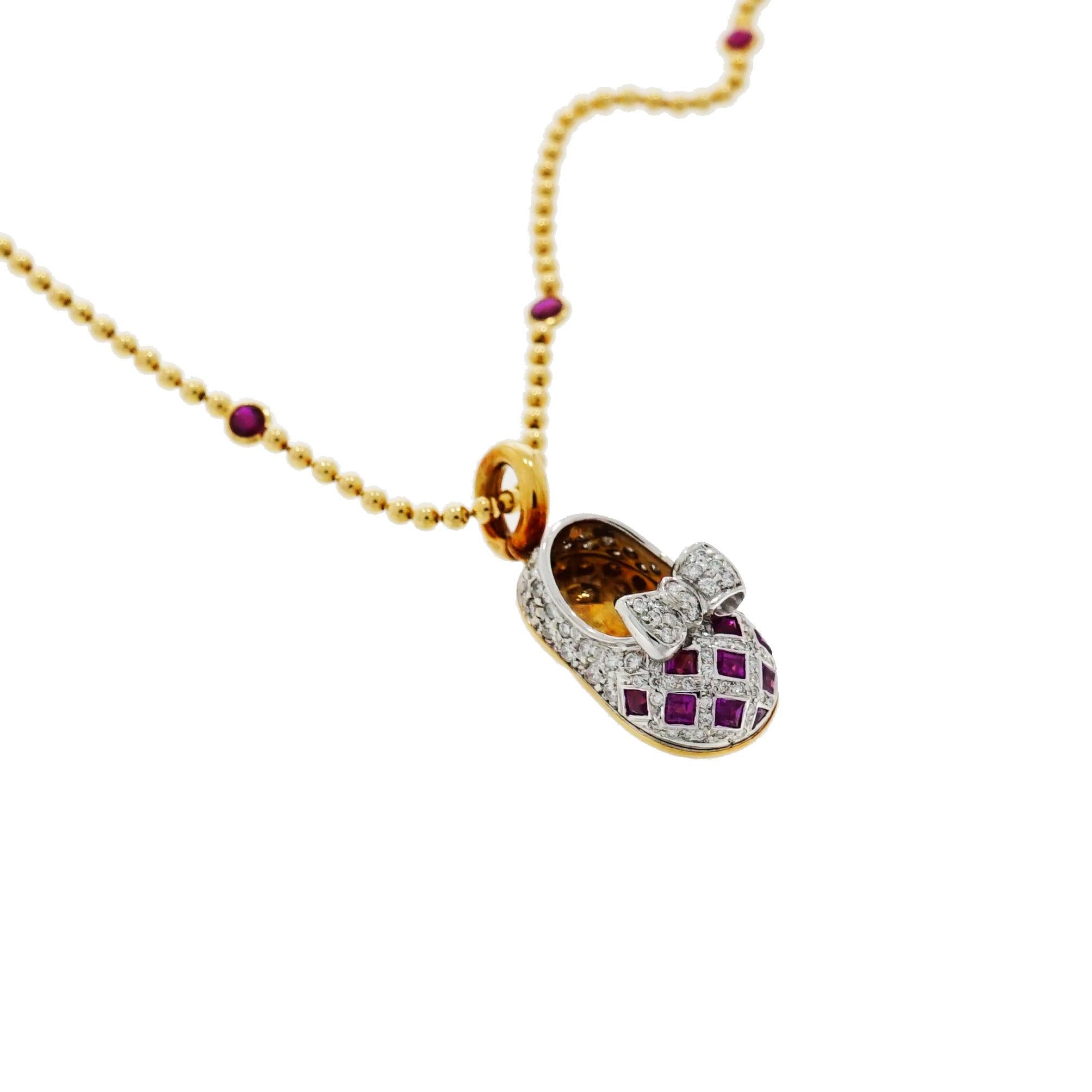 The Aaron Basha baby shoe charms are synonymous with quality, fashion and playful. 
This Baby Shoe is bejeweled with Rubies and Diamonds, crafted in 18k Yellow Gold.
Complemented by an 18k Yellow Gold Beaded chain with 7 bezel set round Rubies.
The