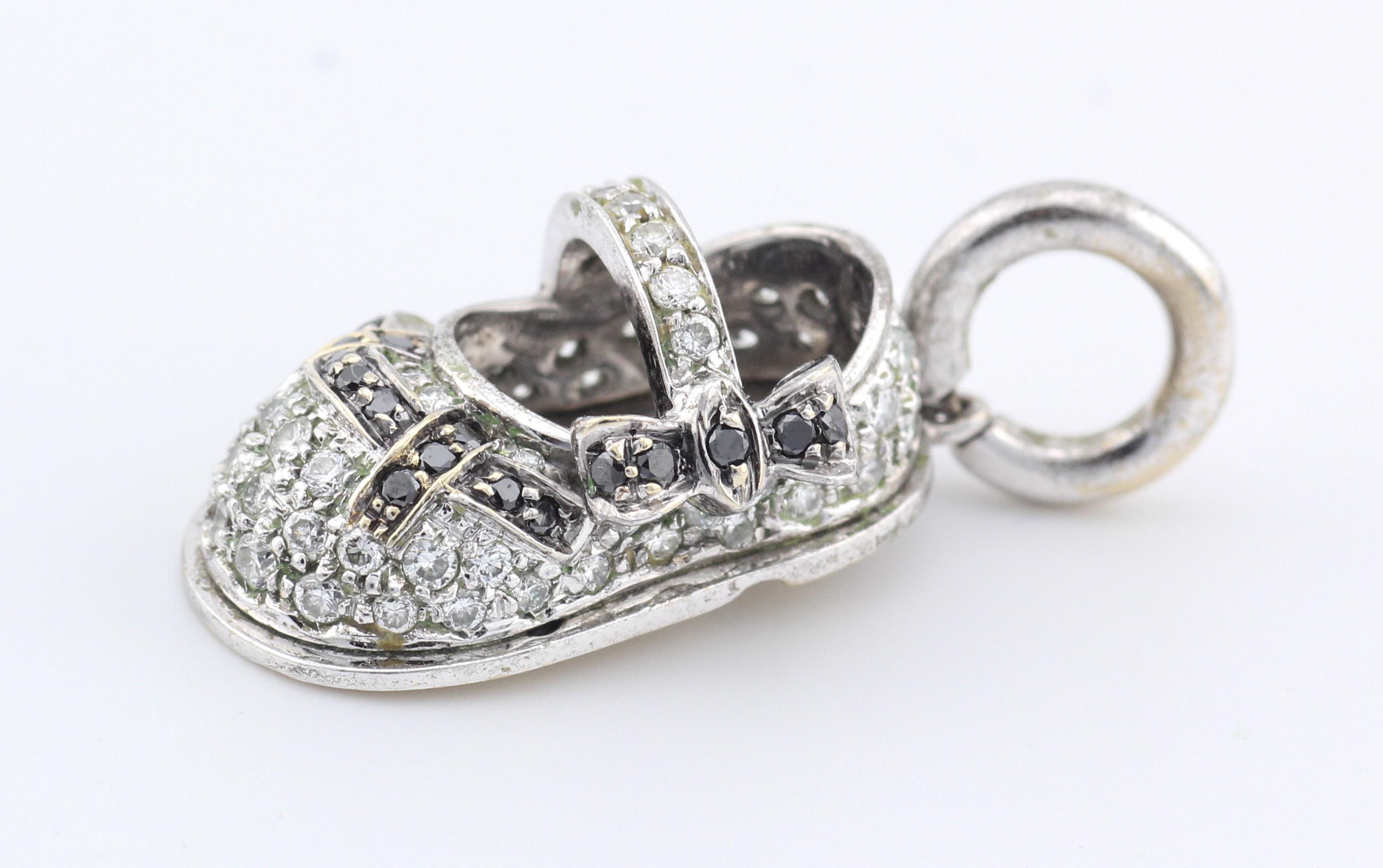Introducing the exquisite Aaron Basha Diamond 18K White Gold Baby Shoe Charm Pendant, a mesmerizing embodiment of elegance and charm. Crafted with meticulous attention to detail, this enchanting pendant is a timeless symbol of innocence and