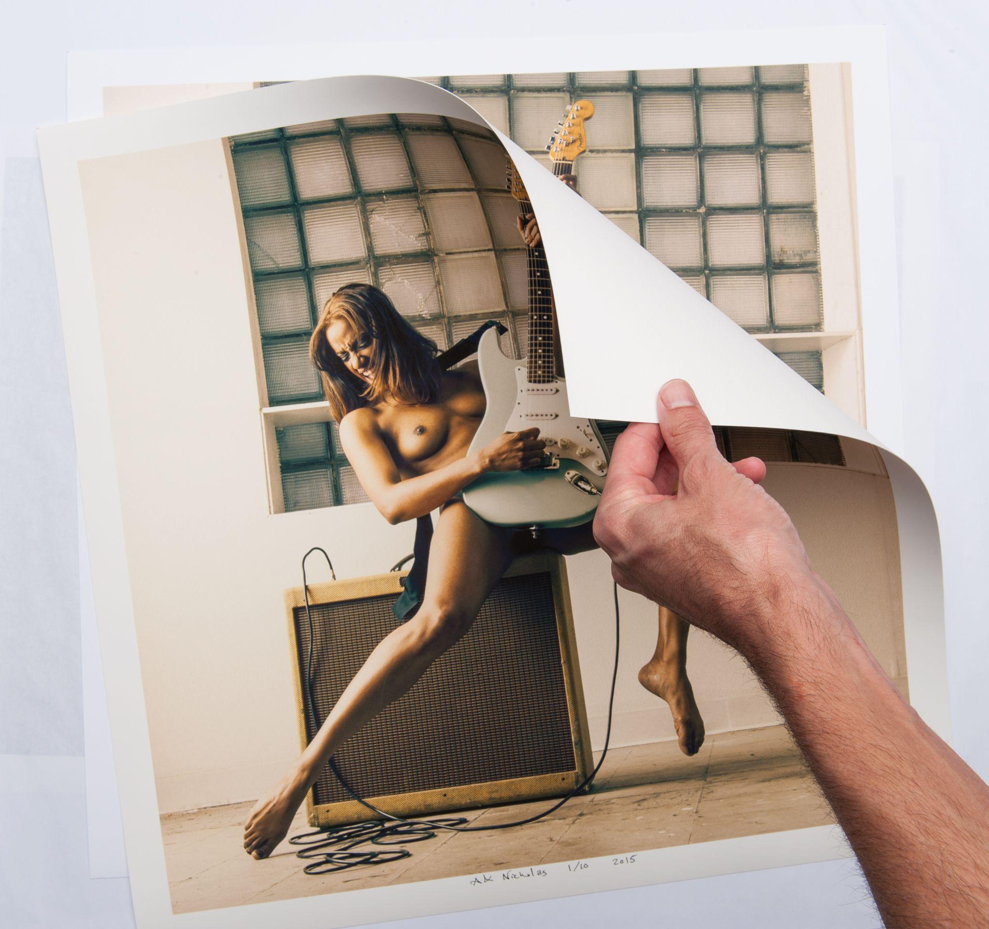 From a limited edition of 10 archival photographs.   Signed and numbered by artist Aaron Knight.   The theme of a woman playing a guitar dates back at least to Johannes Vermeerâ€™s 17th century painting, shortly after the rise of the instrument into