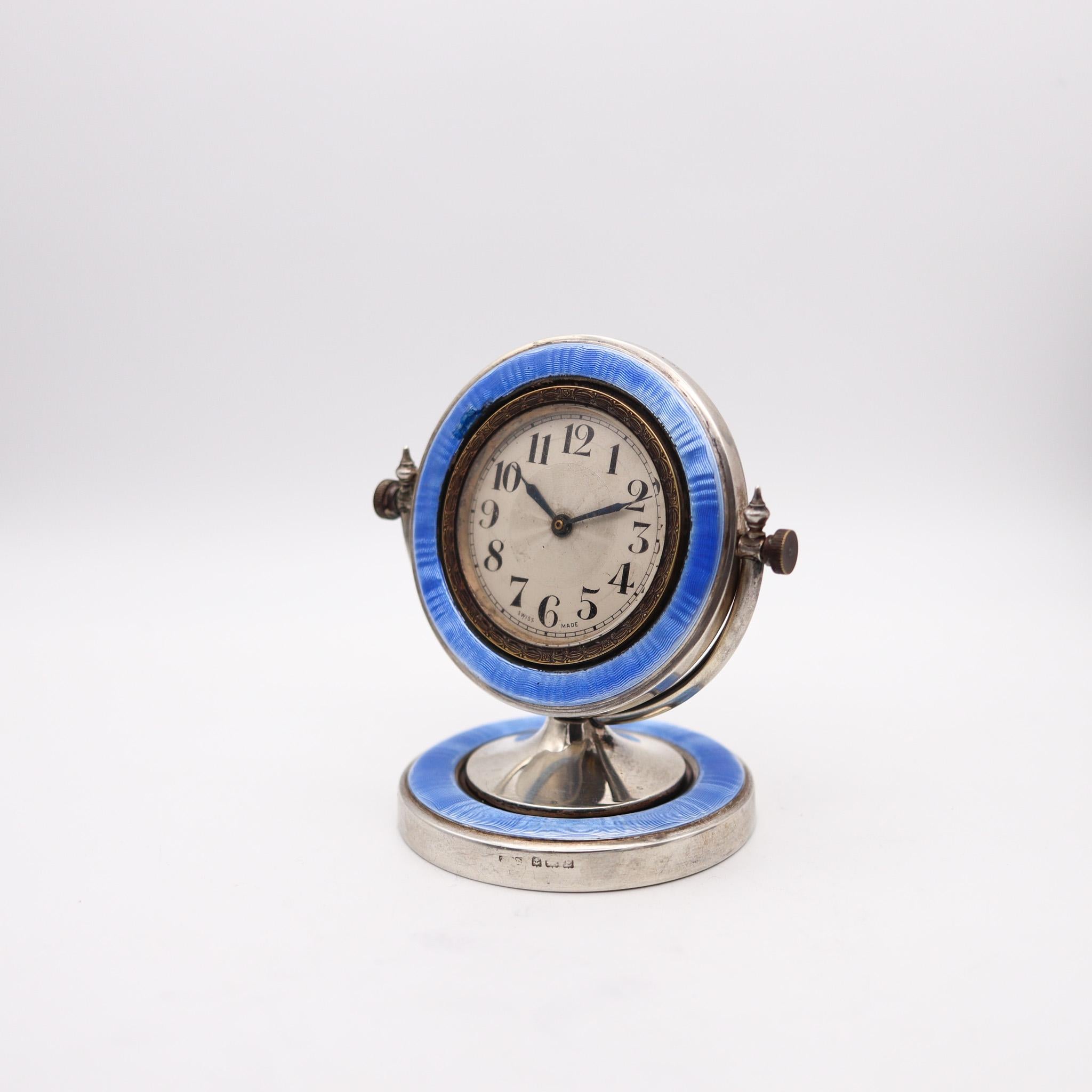 A desk clock with blue enamel designed by Aaron Lufkin Dennison.

This is an exceptional desk clock, made in Birmingham England during the art deco period, back in the 1929. The craftsmanship of this beautiful desk clock is exceptional and was