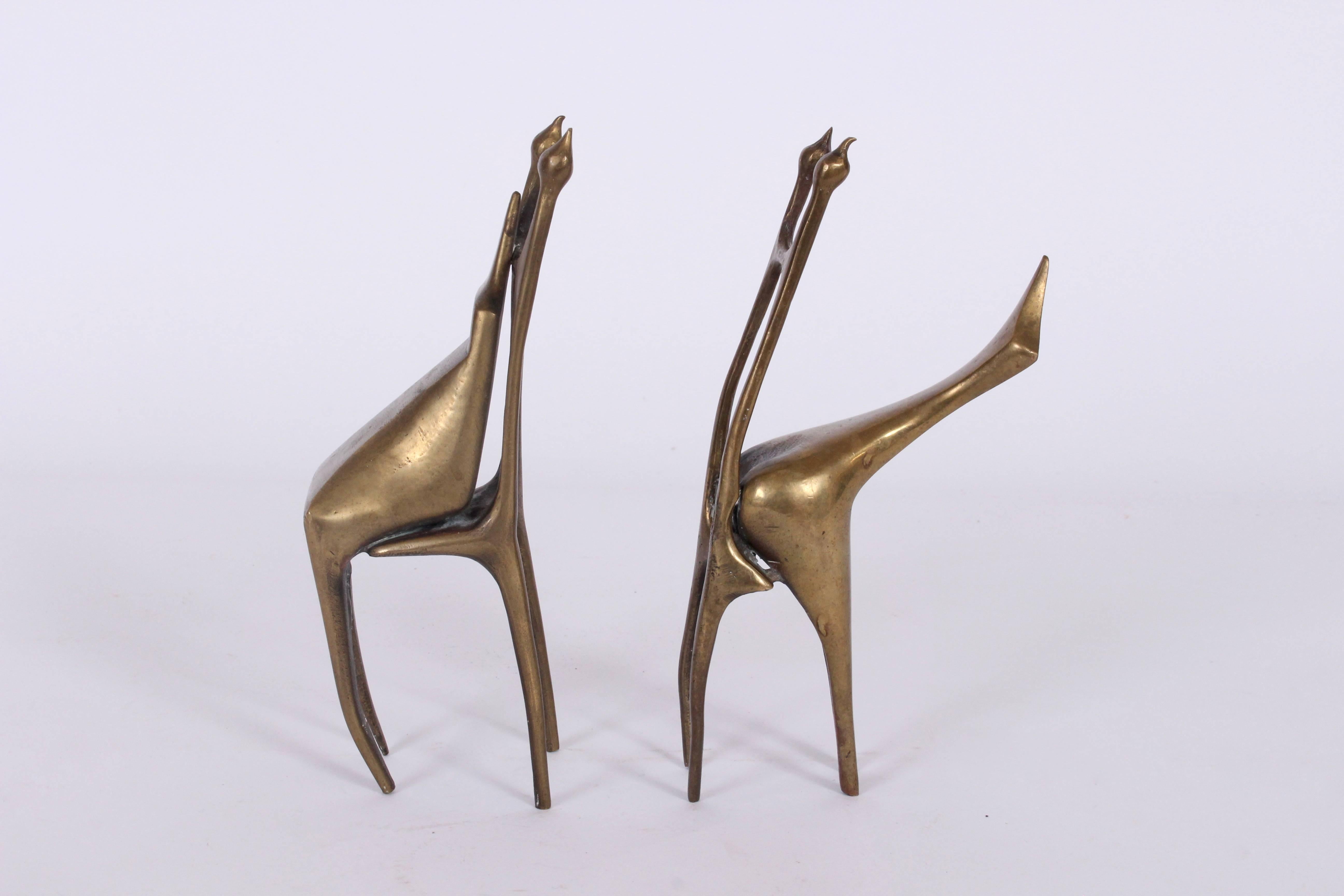 Smaller Post Surrealist. handcrafted studio solid bronze abstract sculptures. Featuring Modern handmade, balanced, chair like forms with seated, leaning figures. Versatile. Bookshelf. Mantle. Signed AB 1977 3/9. Three in series of nine. 