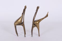 AB Pair of Surrealist Seated Figurative Bronze Sculptures, 1977