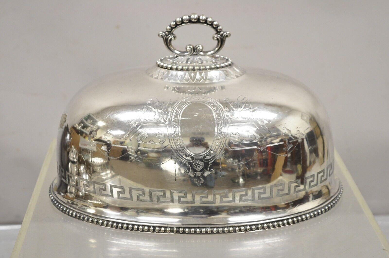 A.B. Savory & Sons Sheffield England Regency Greek Key Silver Plated Dome Cover. Item features an ornate handle, floral shield and drape engraving, Greek key and beaded border, original hallmark, very nice antique. Circa 1900. Measurements:  9