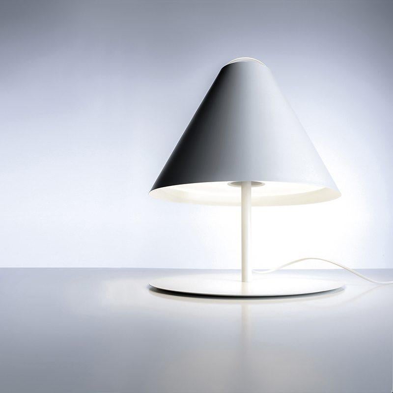 Inspired by the shape of a traditional lampshade.
The bulb is not shielded but displayed, and it peeks out from the shade.
Floor version available.

Color: Matt White

Max 10W - E27
100-240V - 50/60Hz
Bulb not included
Dimmer on board

DIMENSIONS:
Ø