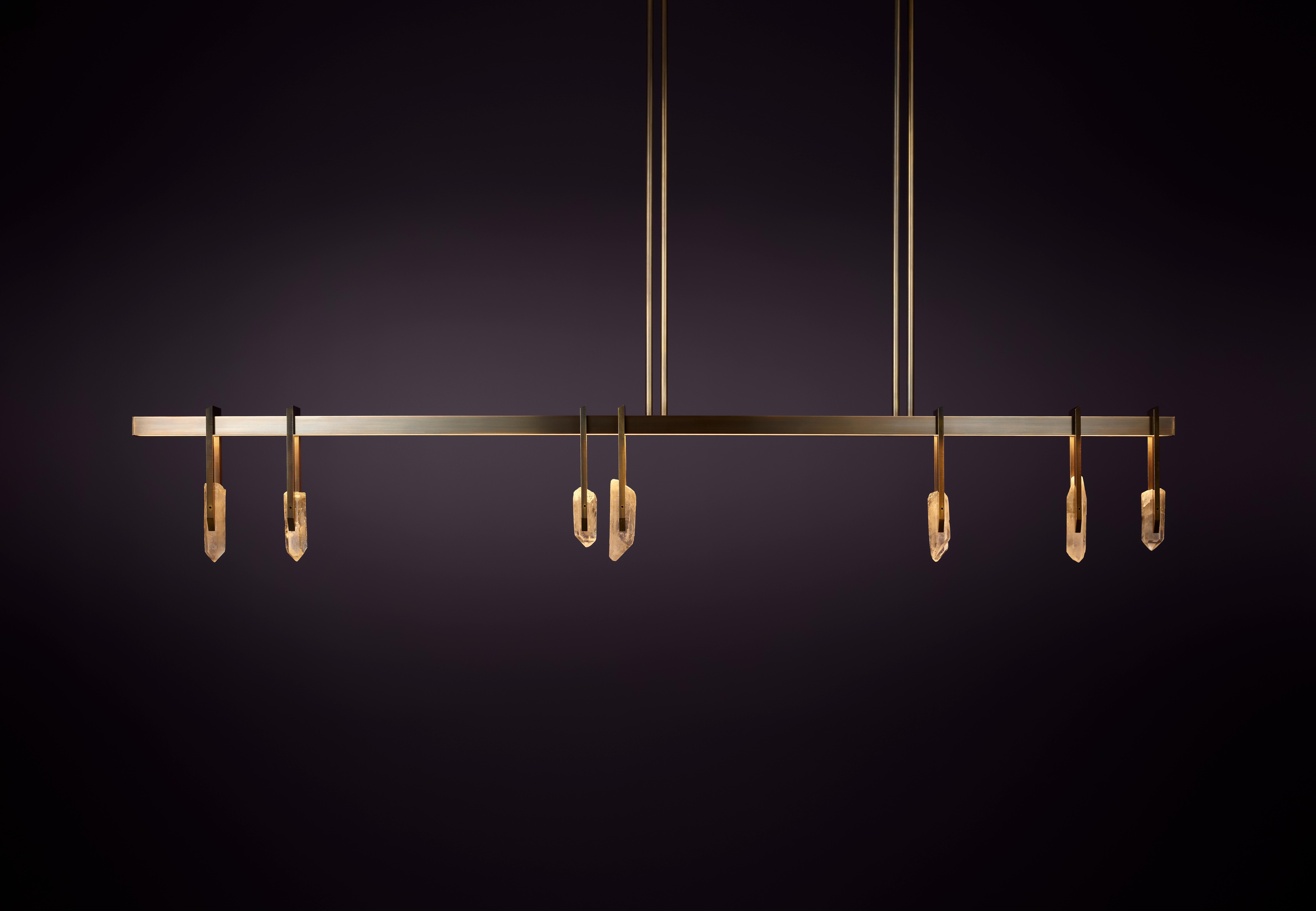 Abacus 180 Pendant Light by Christopher Boots
Dimensions: D 6.5 x W 180 x H 34 cm.
Materials: Natural uncut quartz crystals, Aged brass.

Available in 90cm, 120cm, 150cm, 180cm, 210cm and 240cm.

The Abacus is a sophisticated tool dating back to 300