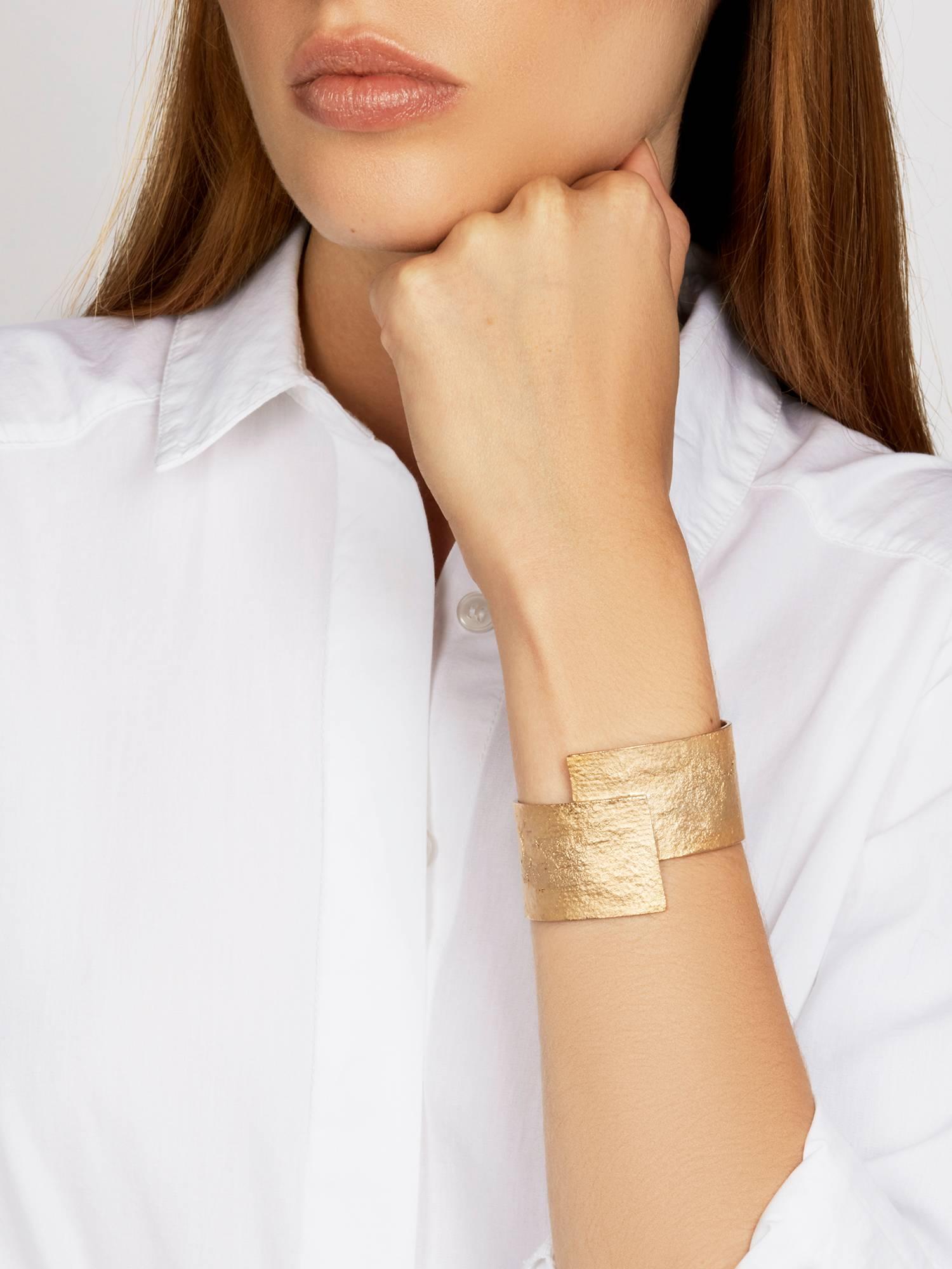 Crafted in solid, glowing bronze, the Abacus Cuff is a subtle statement piece for every day. The unique texture and split detail add interest to this classic wide cuff. 

Every piece in this collection is individually hand-crafted in paper and cast