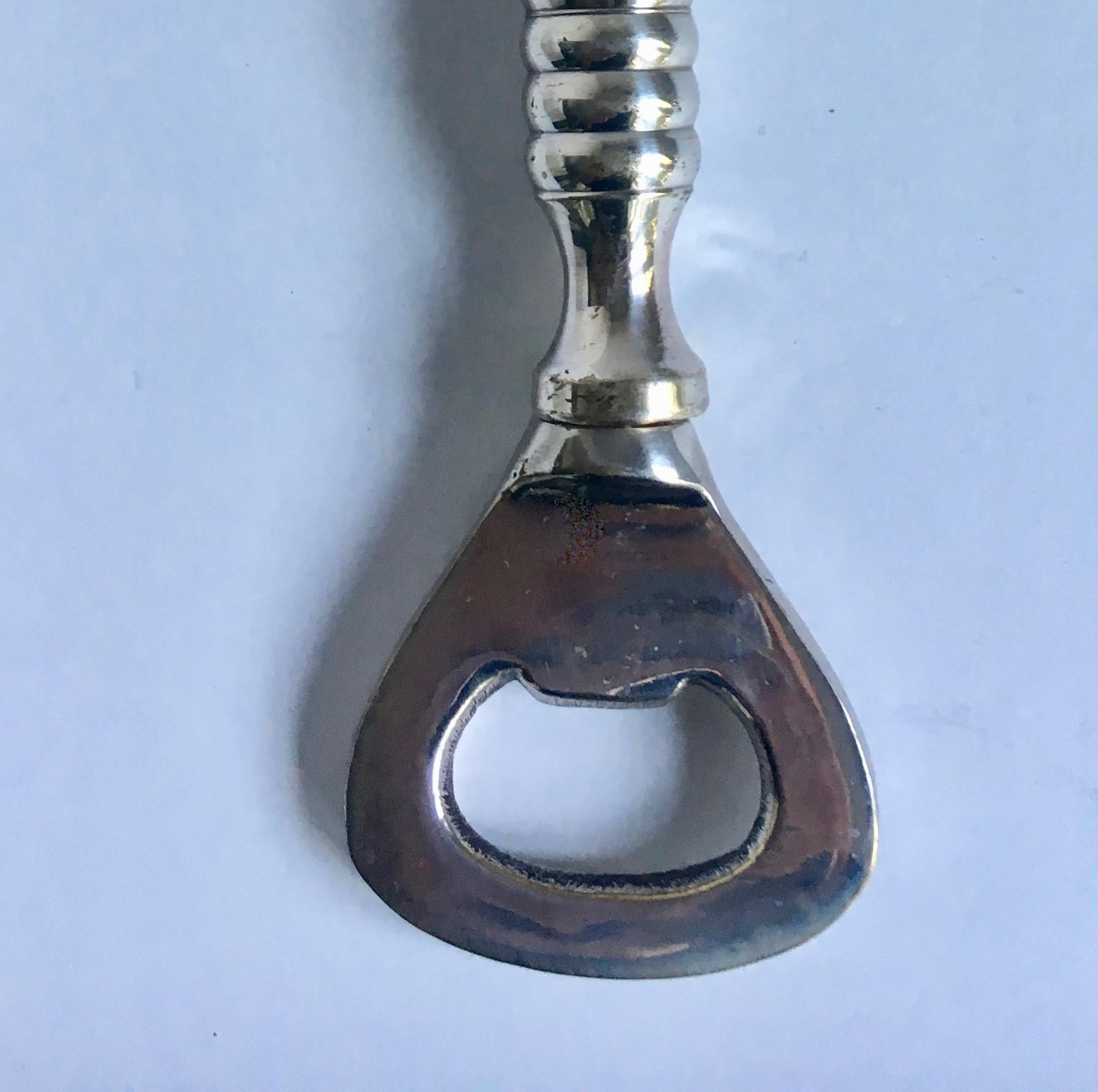 A very handsome bottle opener perfect for any bar or kitchen. Heavy and impressive.