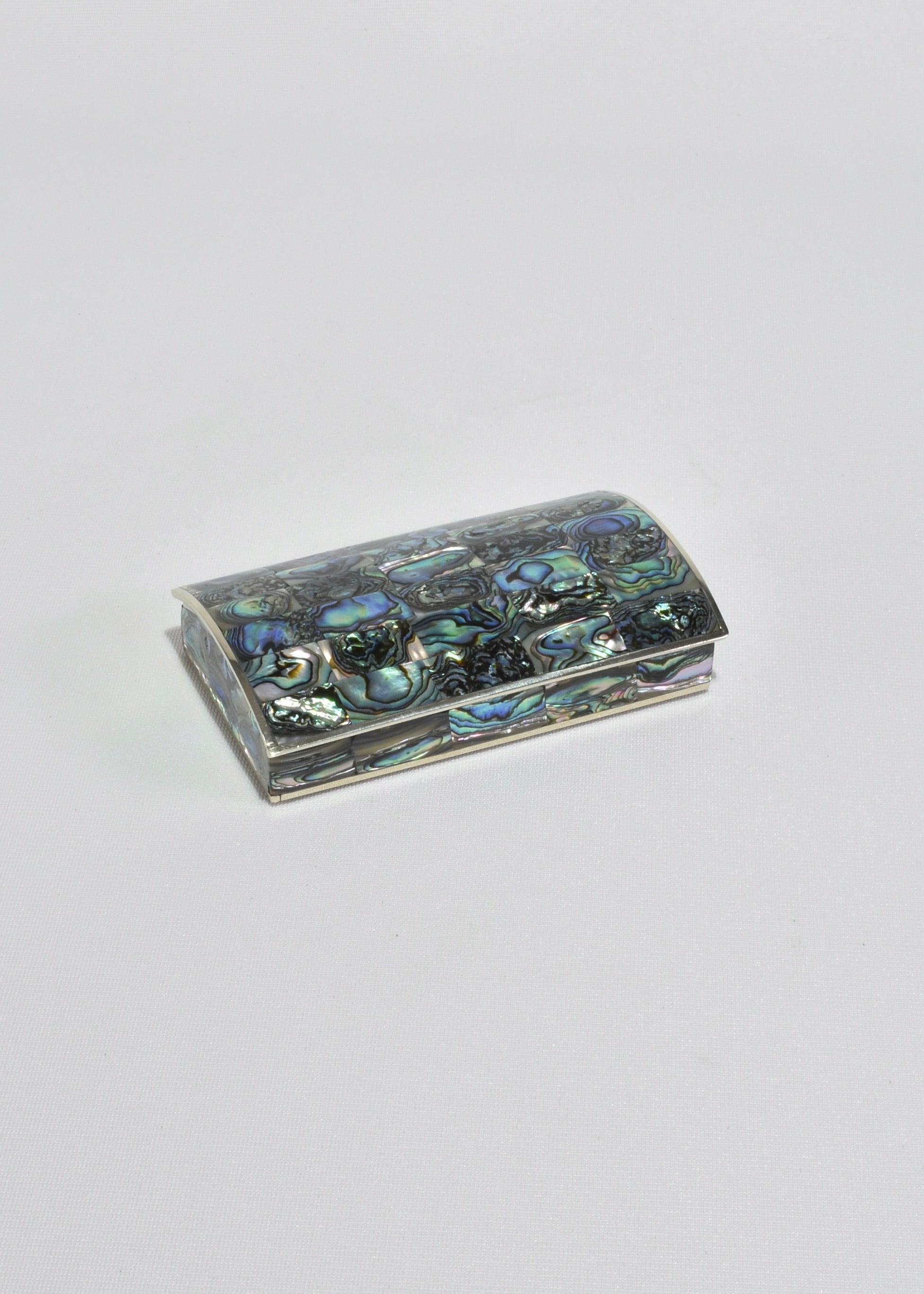 
Beautiful vintage curved abalone shell jewelry box with alpaca silver accents and dark wood interior. Stamped on base Alpaca.