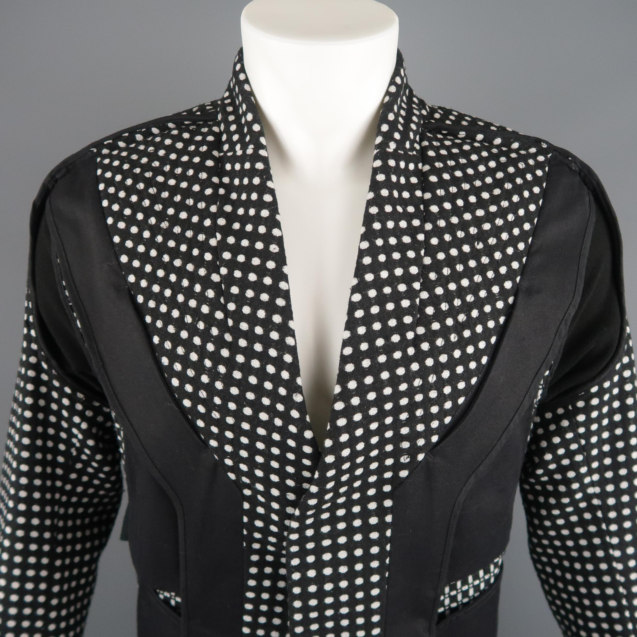 ABASI ROSBOROUGH Dissident Autumn Winter 17 Deconstructed Jacket comes in black and white tones in a solid and polka dots wool materials, collarless, with a magnet closure, pockets at front, back belt, unlined. Made in USA.
 
Excellent Pre-Owned