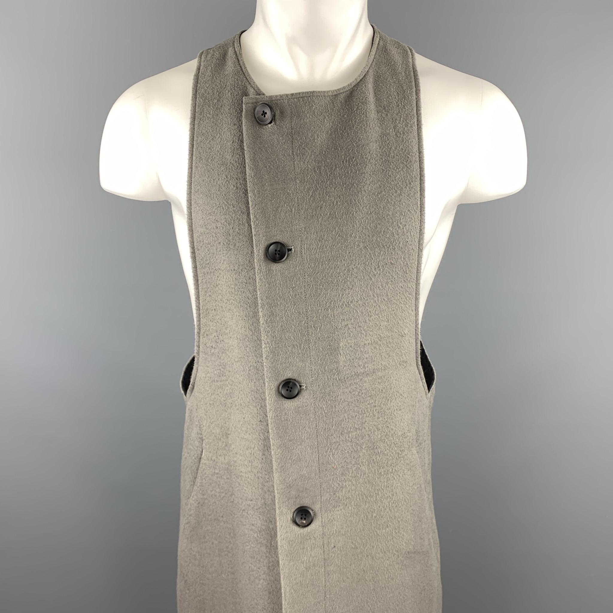 ABASI ROSBOROUGH long vest coat layer comes in grey flannel with a round neckline, asymmetrical button closure, racer back, and slanted pockets 

Very Good Pre-Owned Condition.
Marked: (no size)
Original Retail Price: