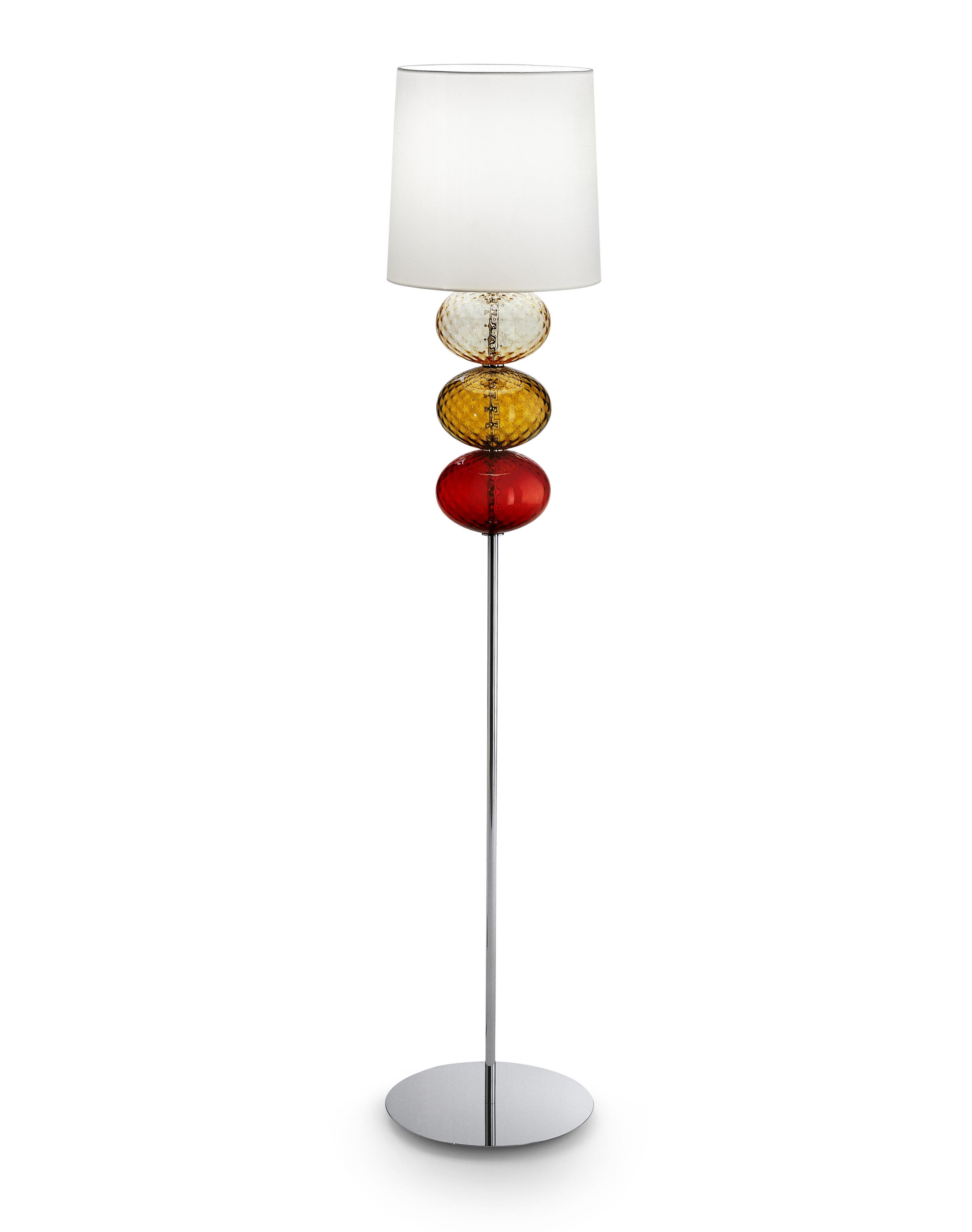 Abat Jour floor lamp with white fabric shade, chromium-plated stand and handmade blown glass elliptical elements. Its combination of white and color make it a subtle yet playful addition to any room. Also available in other colors and as a table
