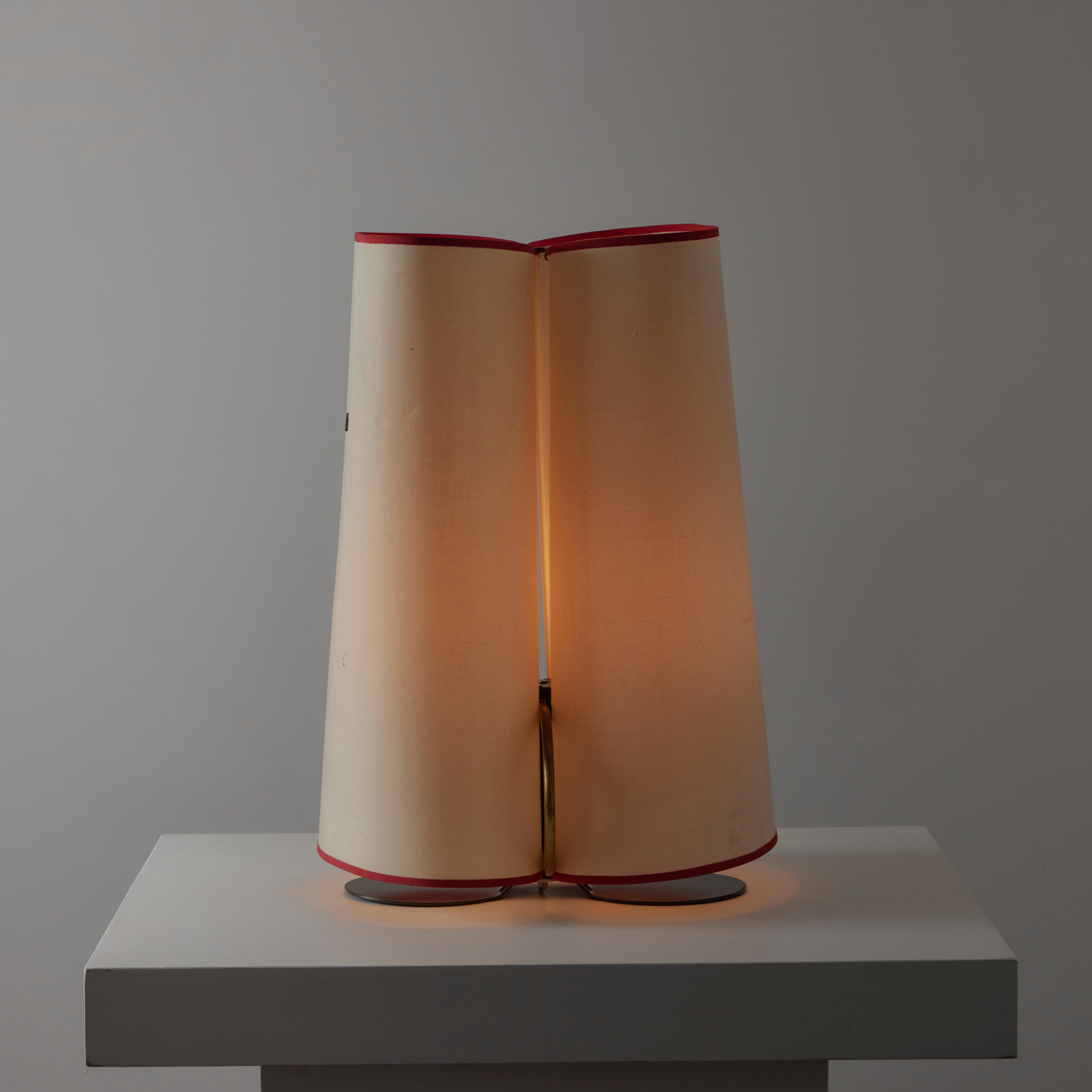 'Abatina' table lamp by Afra and Tobia Scarpa for Flos. Designed and manufactured in Italy, circa the 1980s. Beautifully crafted double-panel wrapped contraption by the duo designers. Each panel consists of a thick paper which is trimmed in a red