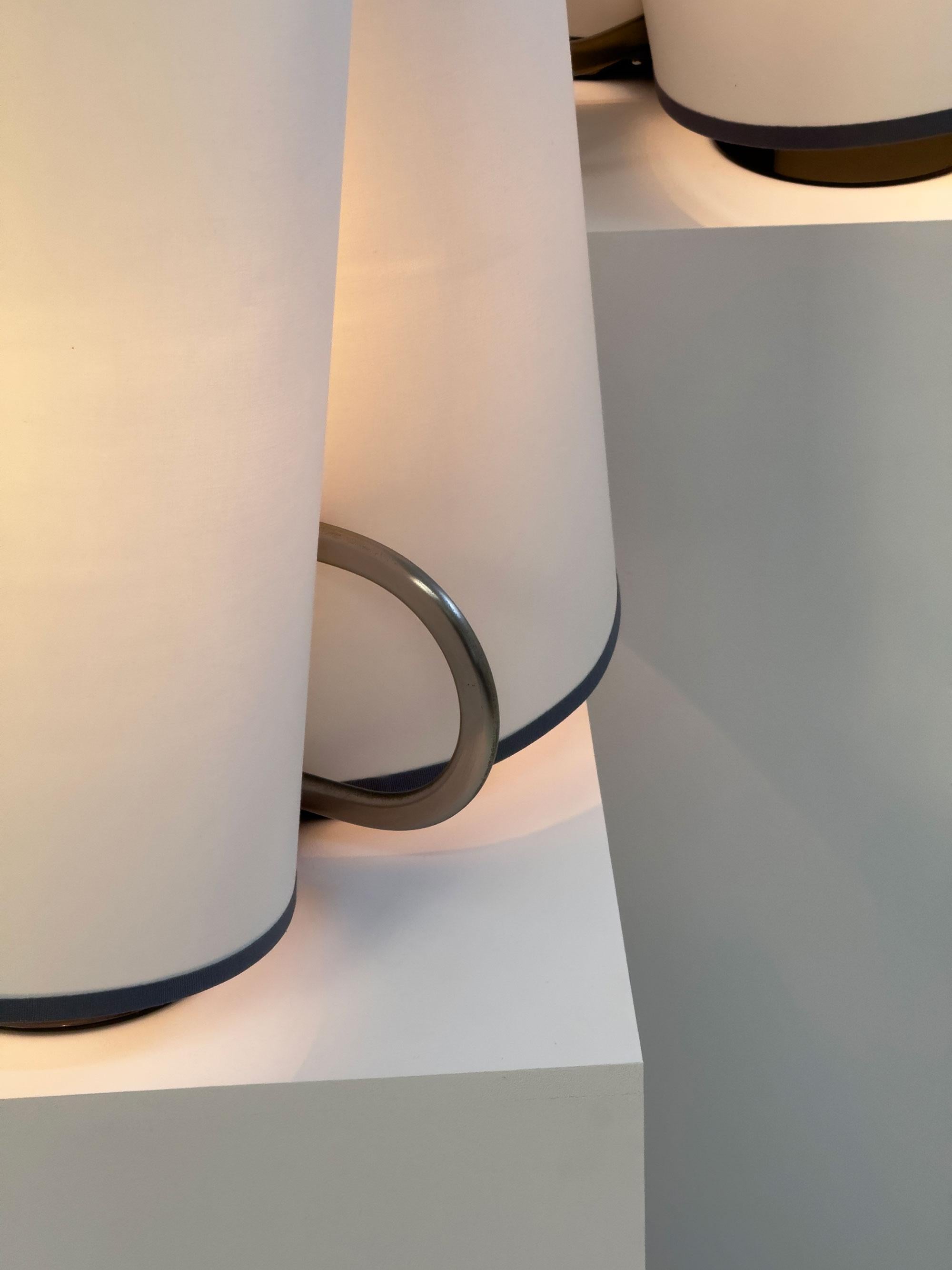 Designed by Afra and Tobia Scarpa for Flos, the ‘Abatina’ table lamp is a true celebration of the elegance and excellence that defined Italian design in the 1980s. 

This sophisticated lighting piece captivates with its distinctive double-panel