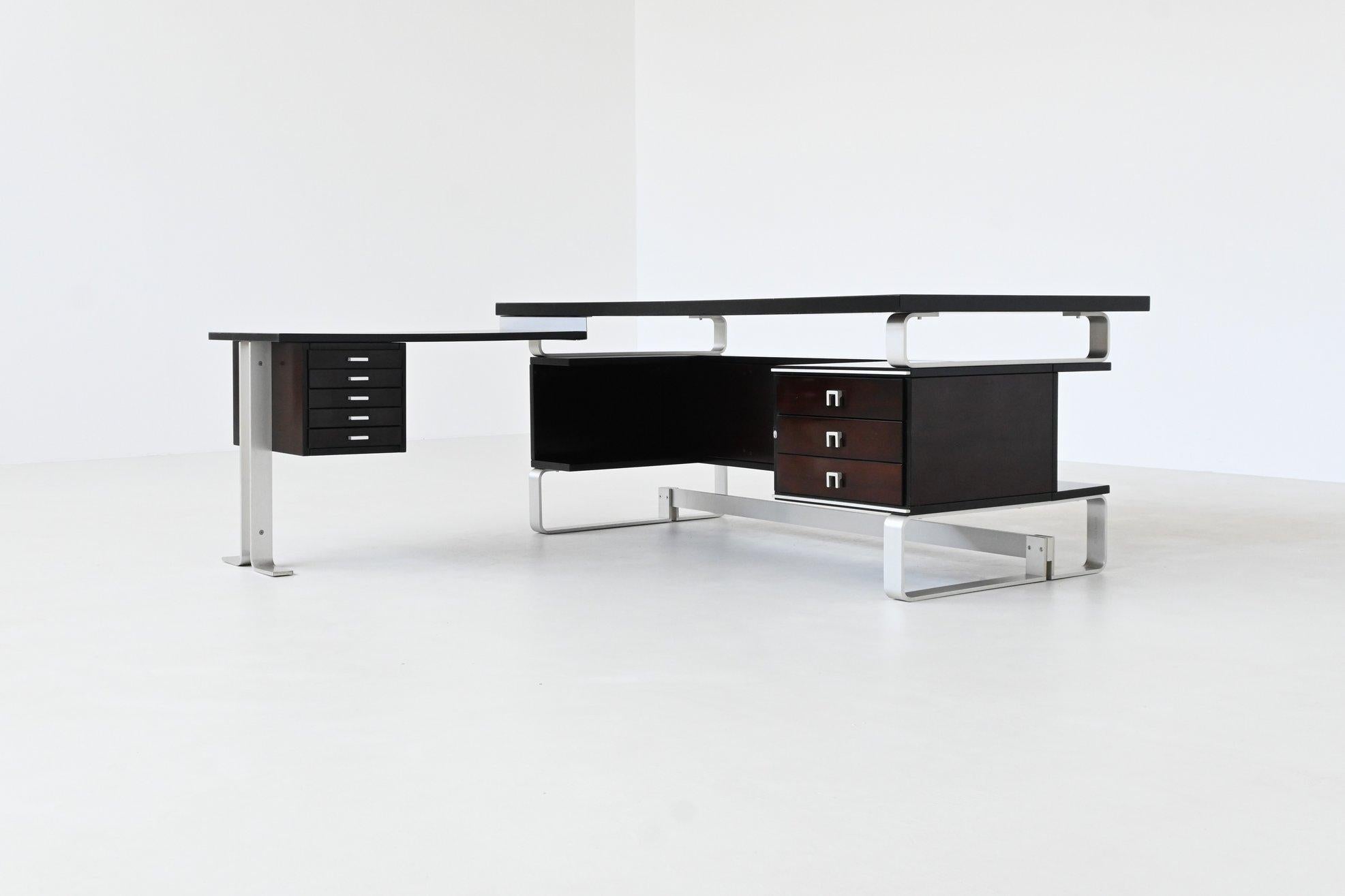 Stunning corner desk designed and produced by Abbondinterni in Milan Italy 1970. This desk is a standout example of Italian executive design from the postmodern era. It is constructed in richly grained mahogany and features an angular layout