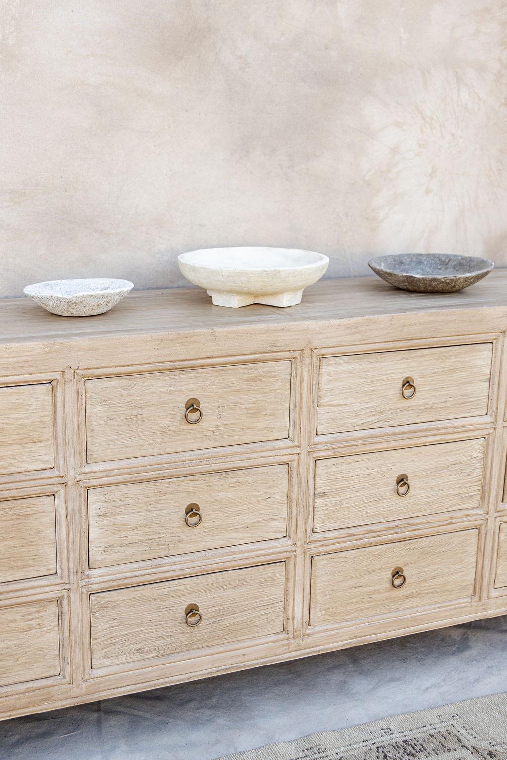 Introducing our Abbott 12 drawer dresser. Crafted from elm and oak wood sourced throughout Europe and Asia. No two pieces are the same.