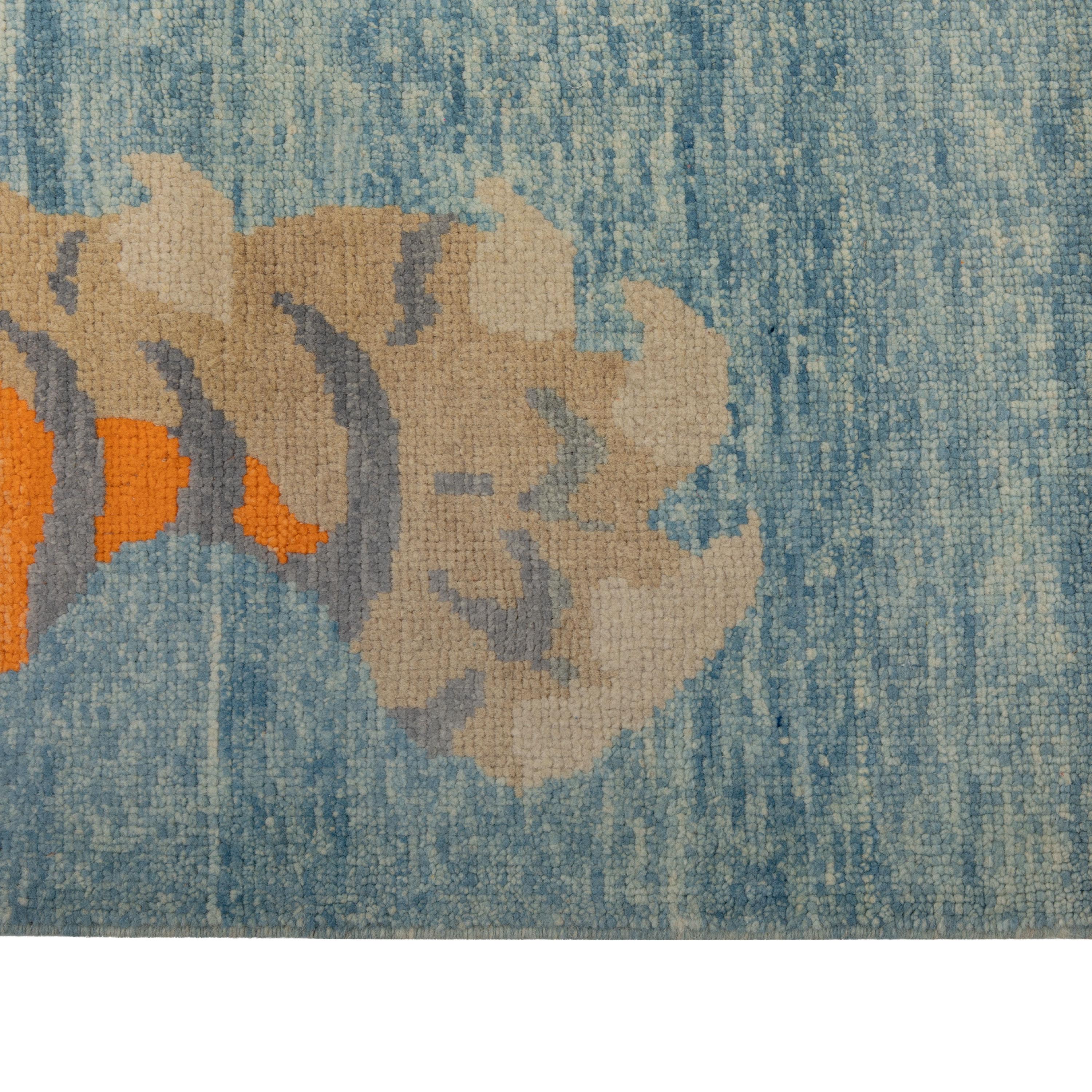 This Blue Contemporary Tiger Wool Rug is a stunning piece of art for your floor. Hand knotted in Turkey, this 6'12