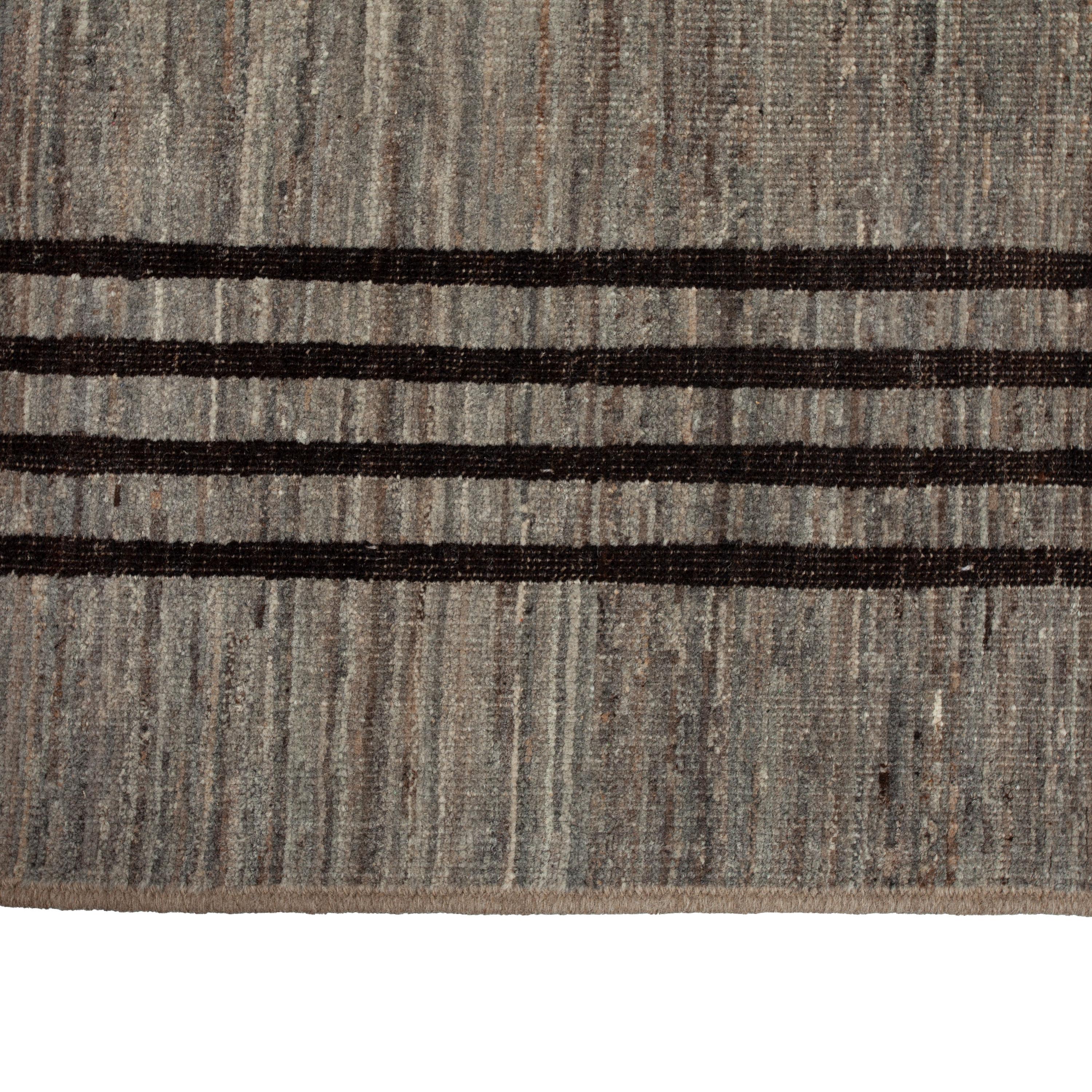 Inspired by the grounding foundations of Earth's natural colors and pure materials, this Zameen Brown Striped Modern Wool Rug - 10'6