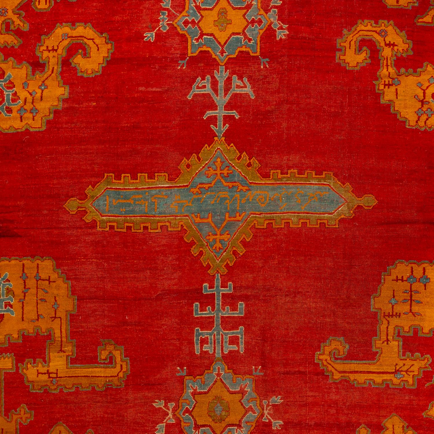 Featuring a vibrant canvas bursting with regal red hues, this traditional rug is hand-knotted in the Anatolian style of weaving, The color-work is big, bold, and powerful, providing a sense of warmth and soul that can only come from something