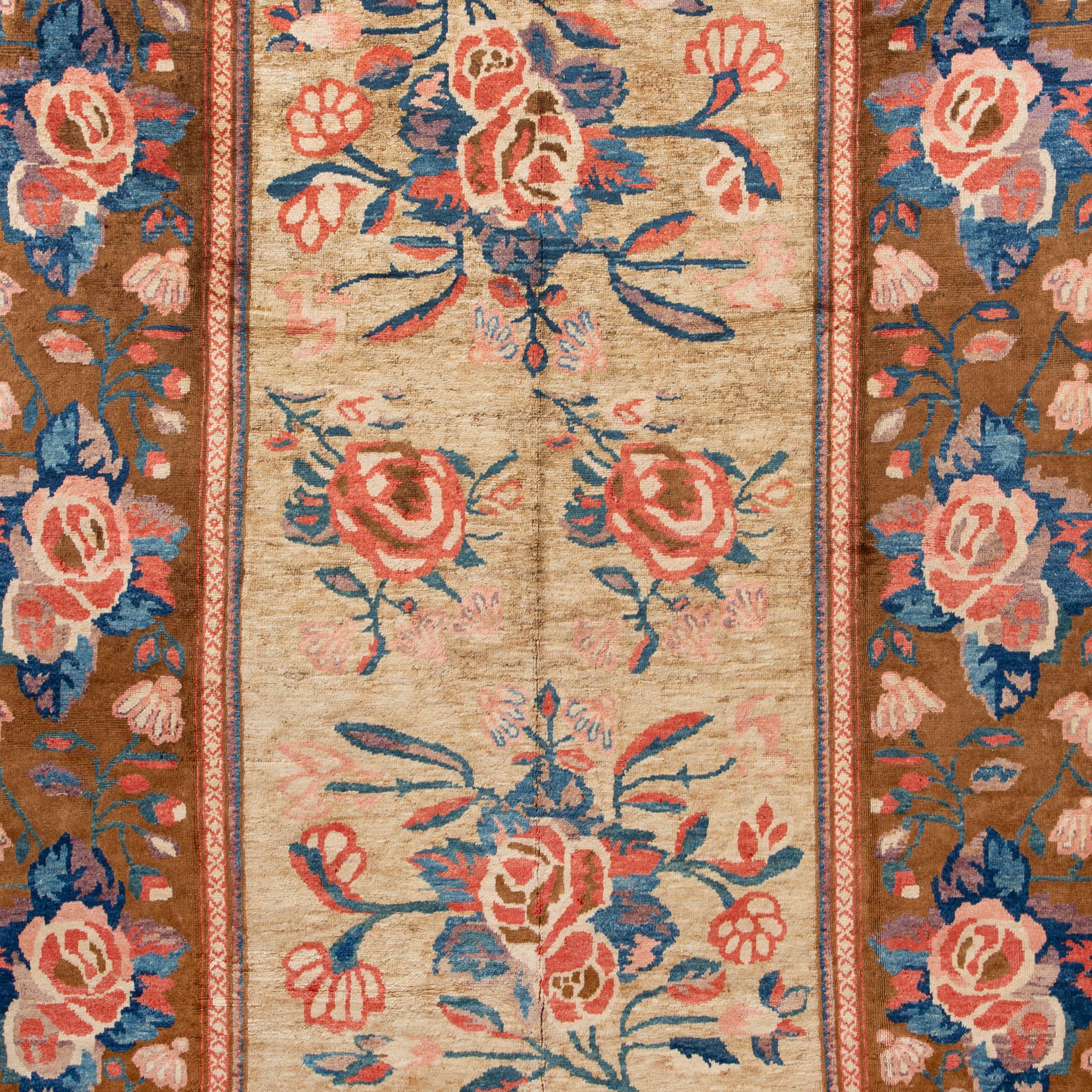 Large-scale floral motifs punctate a copper and ivory ground on this Karabaugh Traditional Rug - 8' x 11'9