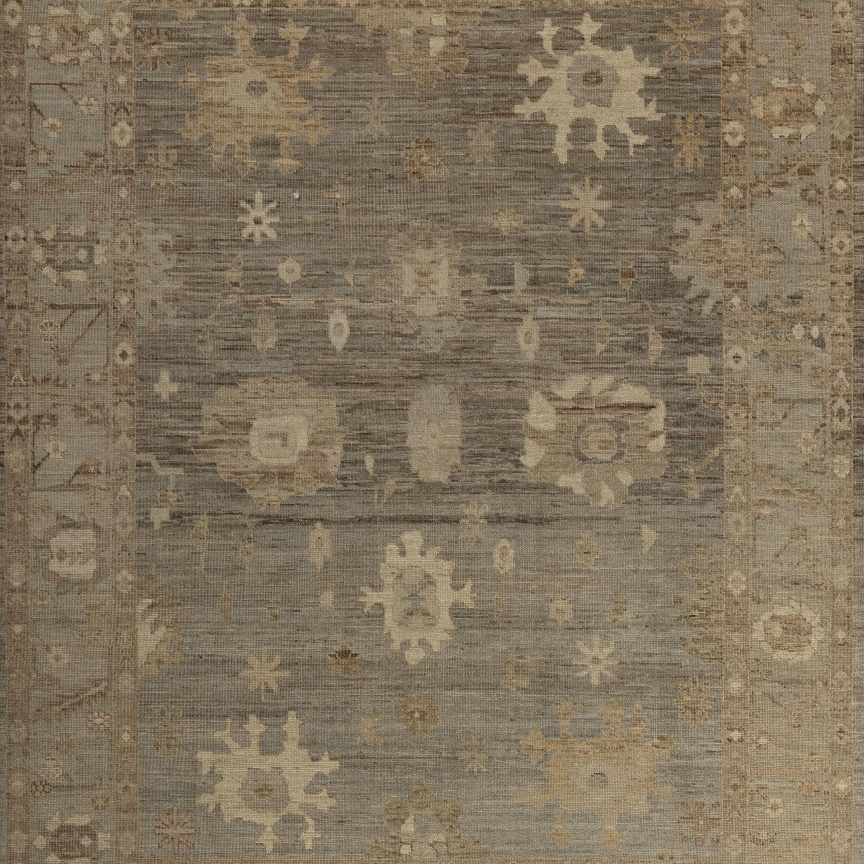 Inspiré par les fondements des couleurs naturelles et des matériaux purs de la Terre, ce tapis de laine traditionnel multicolore Zameen - 7'8