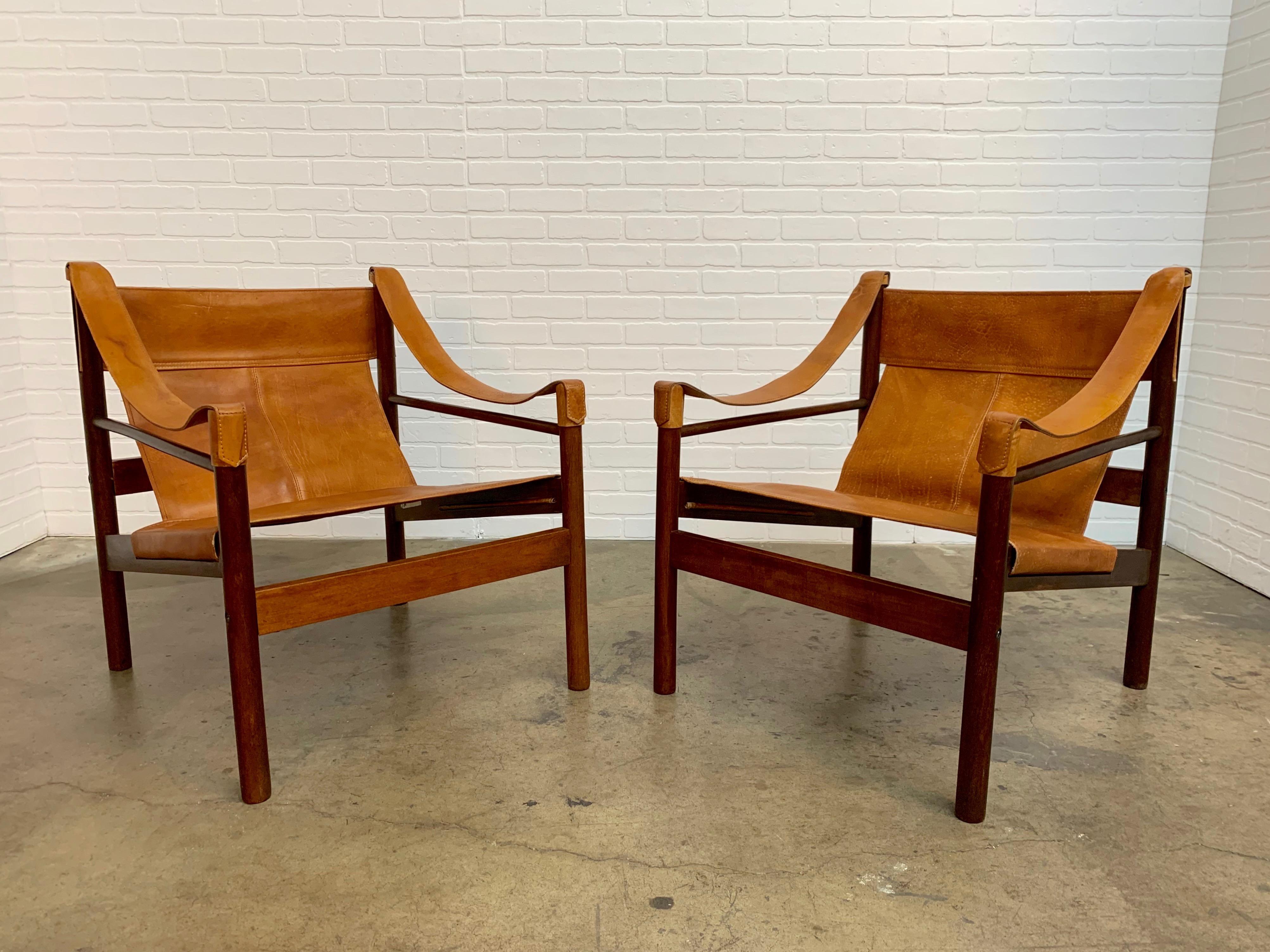 Pair of solid Mahogany with caramel tan leather lounge chairs 1960s made in Argentina by Abel Gonzalez.