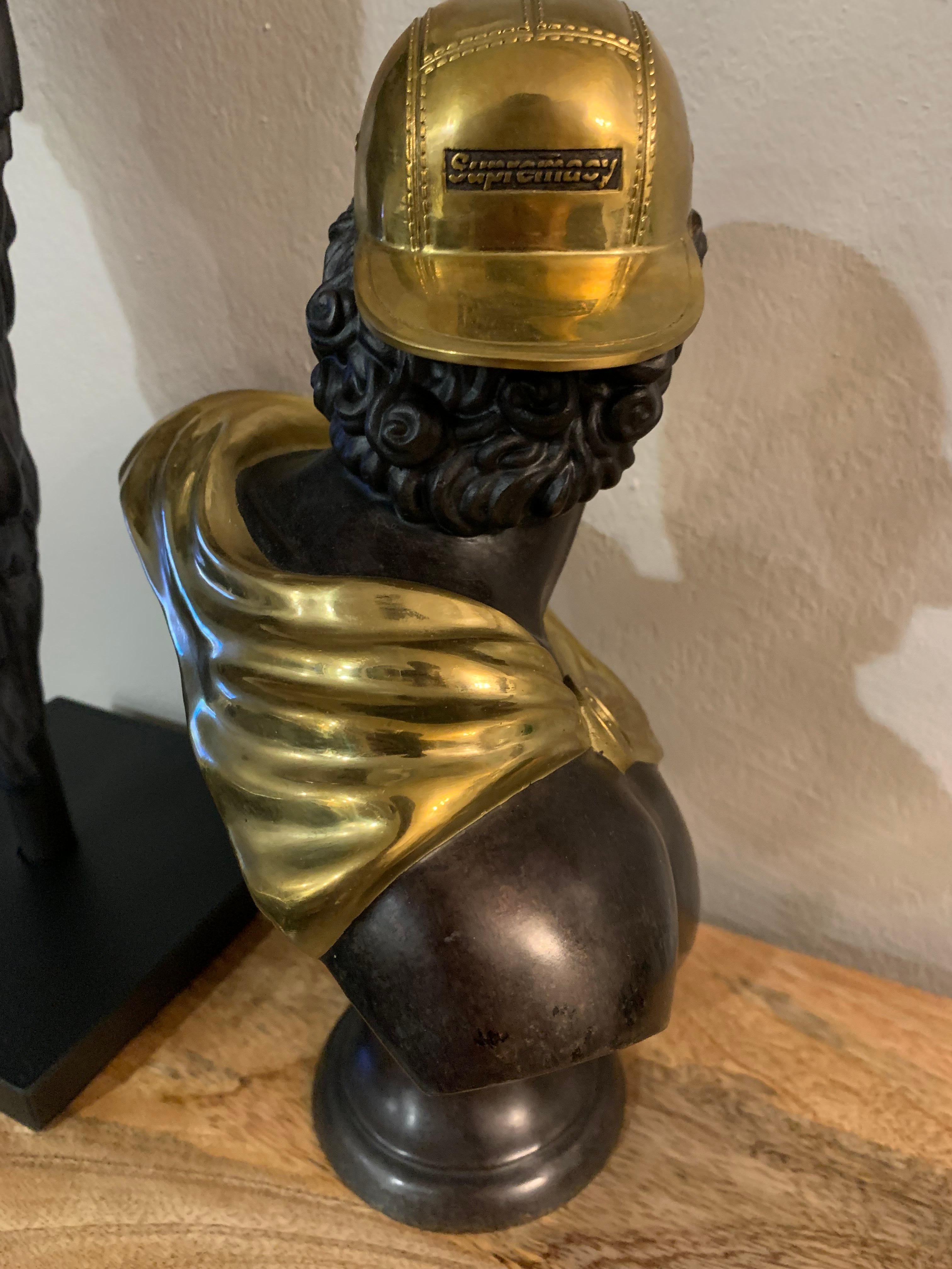The Forgeworked Anti Supremacy (The Legacy) bronze edition of Abell Octovan’s urban-meets-classical rebellious piece celebrates its ancient inspiration through the use of the traditional statue material popularized by the Greeks and Romans. The gold