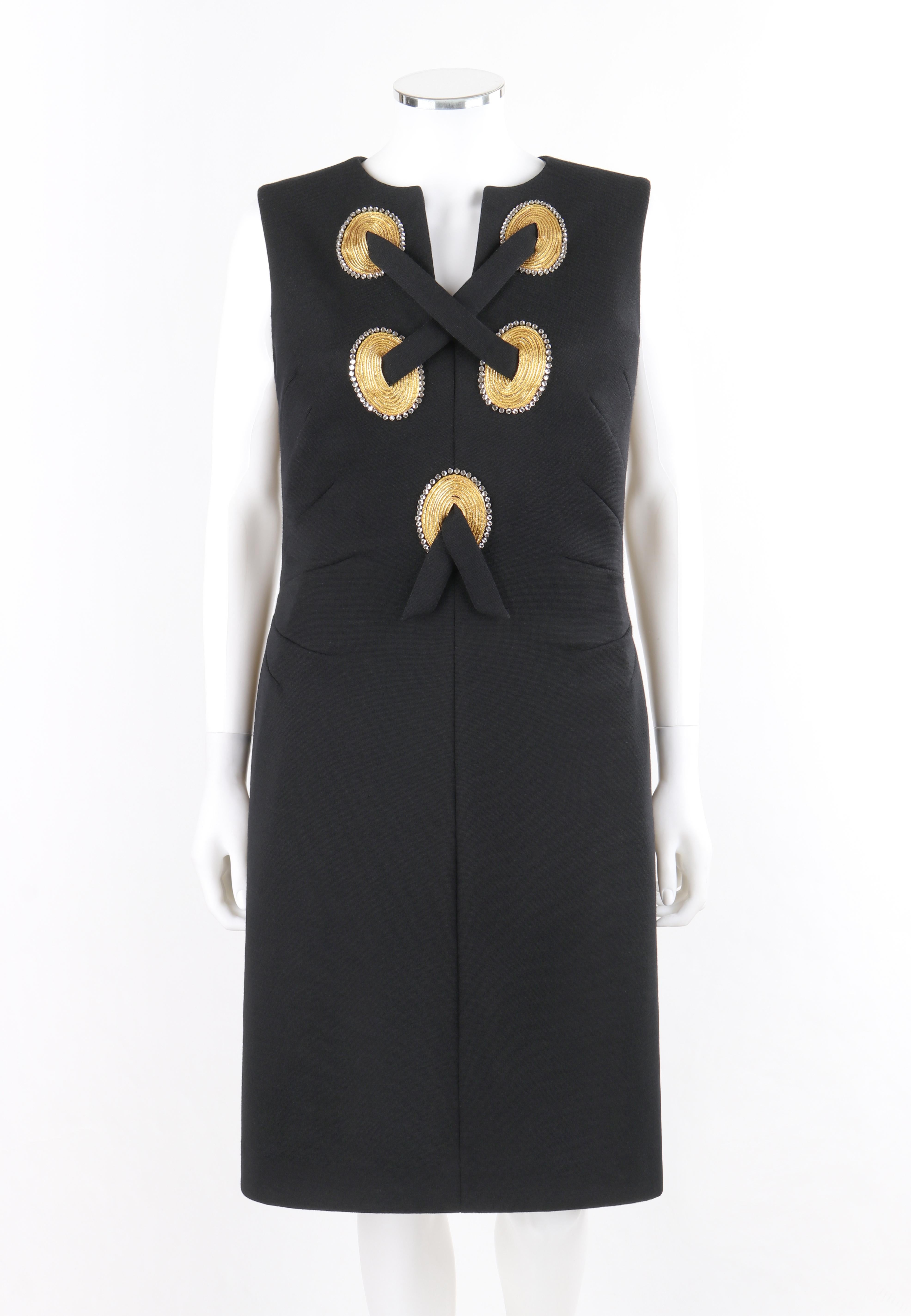 ABELLA PARIS c.1960’s Black Gold Embellished Lace-Up Front Fitted Sheath Dress

Circa: Late 1950's/ early 1960’s 
Label(s): Abella Paris; garment number tag
Style: Sheath dress
Color(s): Shades of black, gold, and silver
Lined: No
Unmarked Fabric