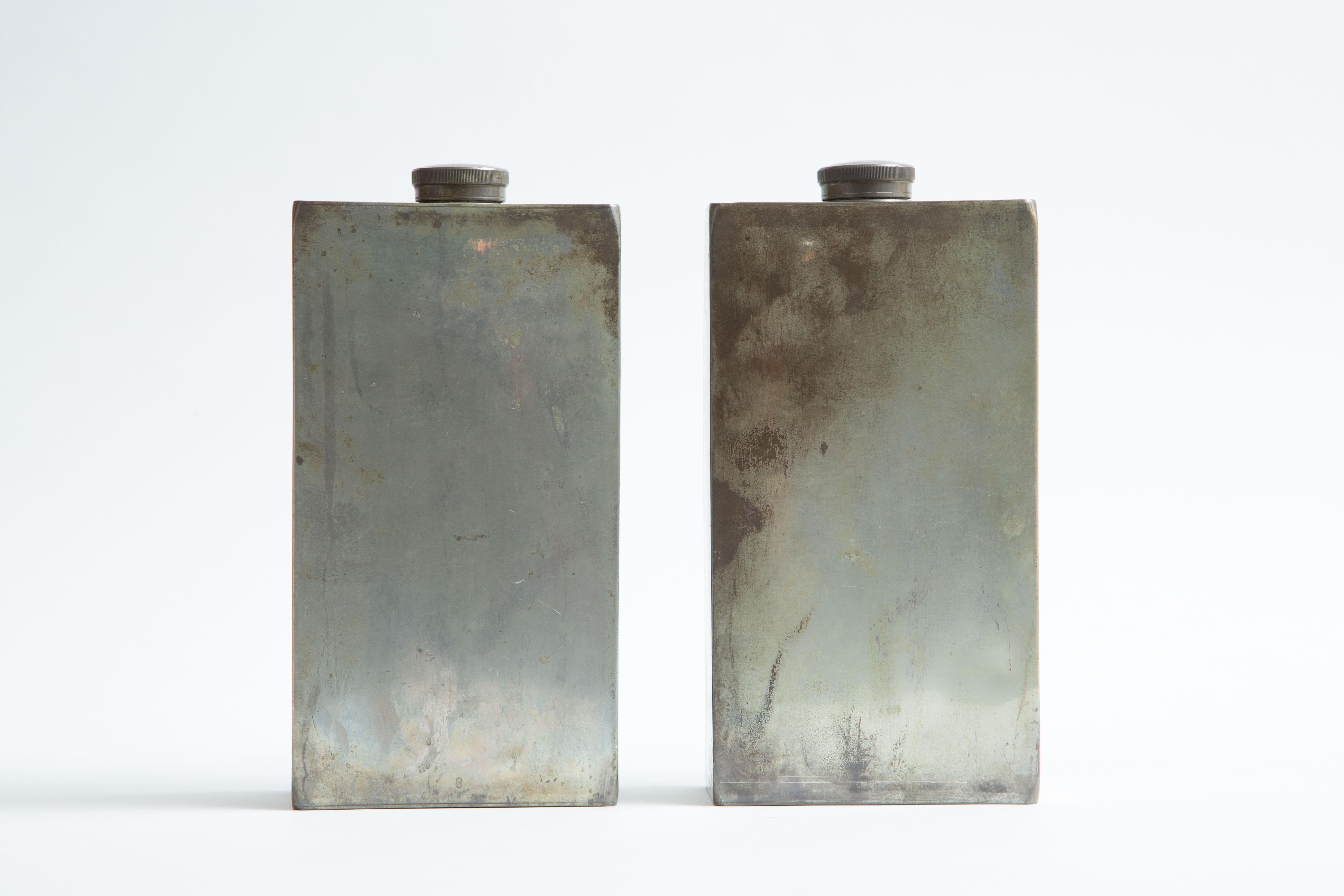 A pair of signed, hallmarked drinking flasks.