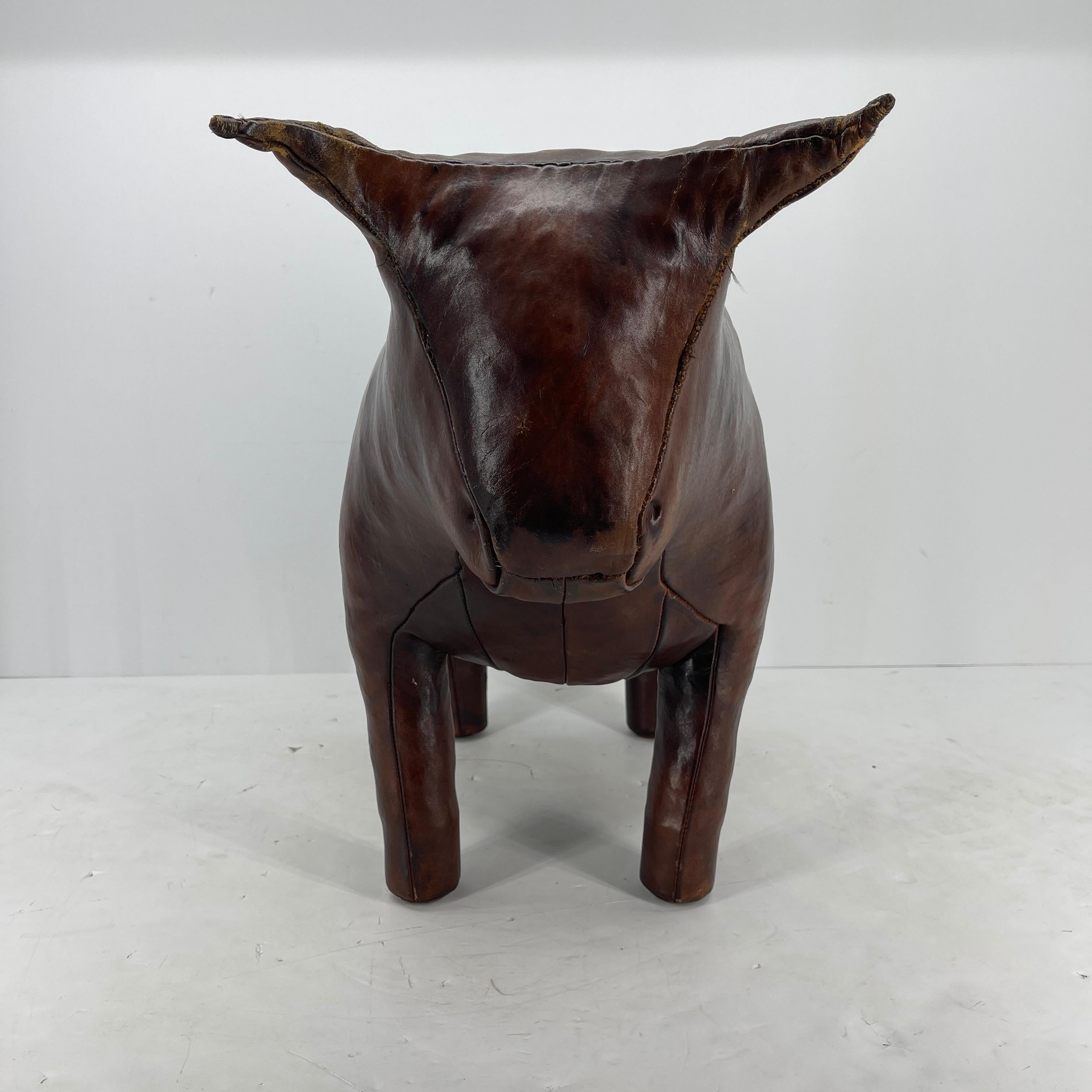 Mid-Century Modern Abercrombie & Fitch hand-stitched leather bull by Omersa & Company. The wide selection of leather animals designed by Dimitri Omersa were used for display and footstools at the Abercrombie and Fitch stores in England in the 1960s.